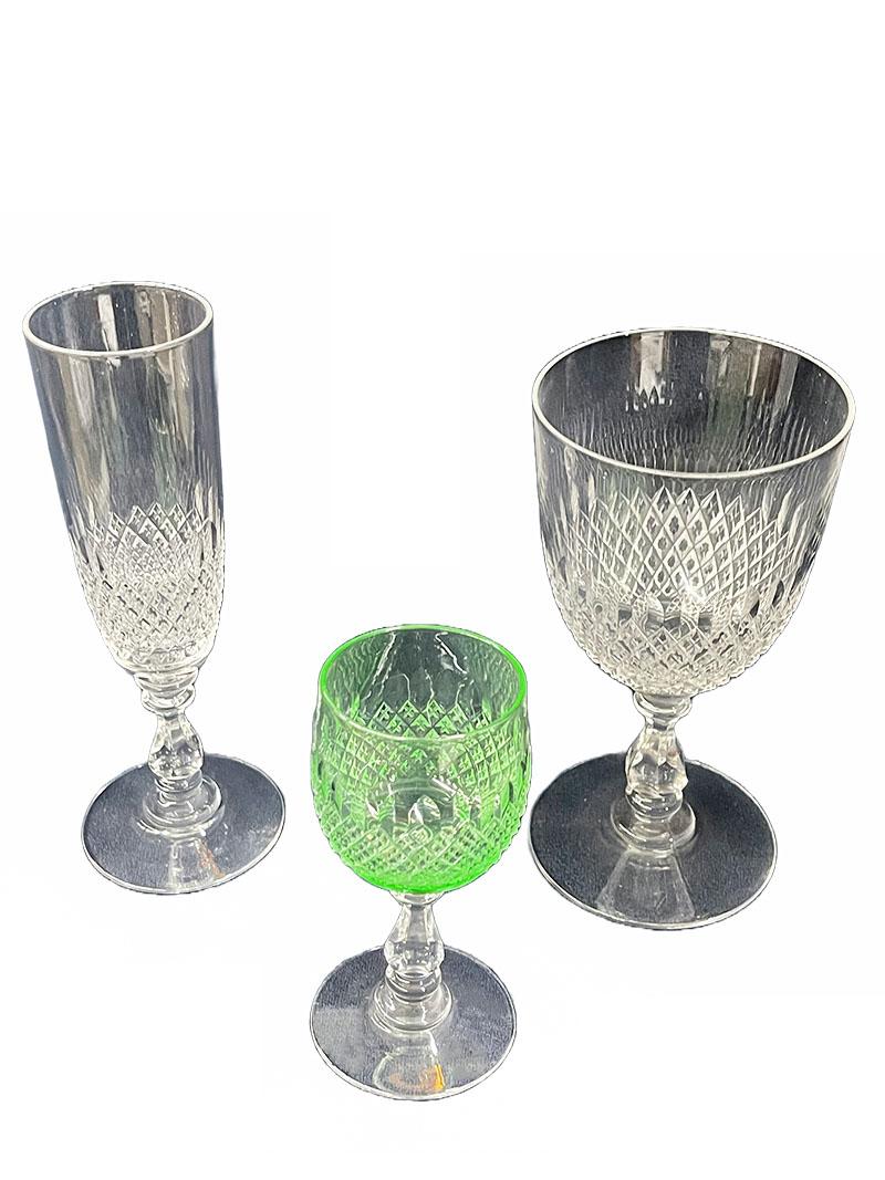 Crystal glasses of 54 pieces, set for 18

An english set of crystal glasses with diamond cut and oval pattern. 
Mid-20th century. 
18 pieces of wine glasses of 15.5 cm high and 8 cm diagonal
18 pieces of champagne glasses of 17.5 cm high and