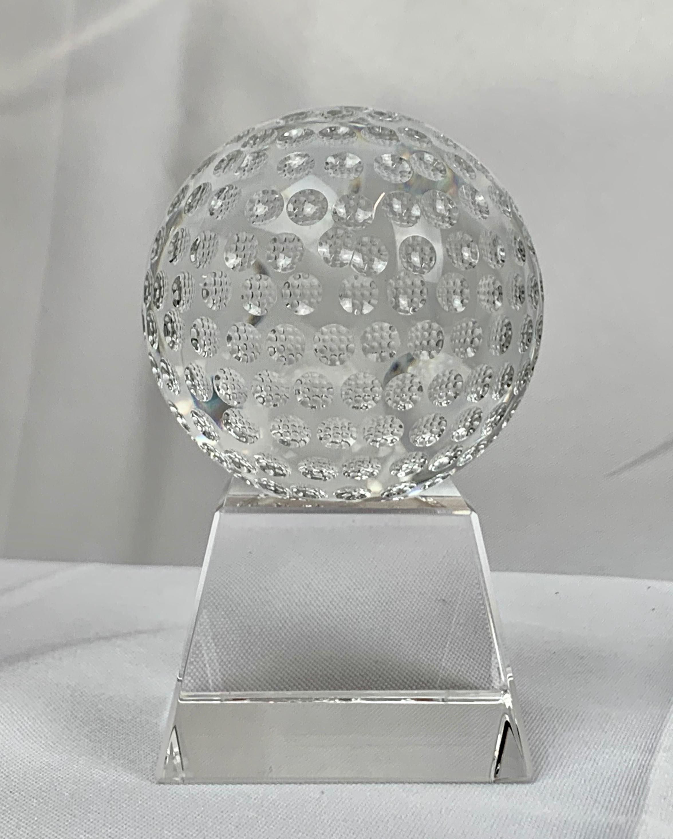 Two part handsome crystal golf ball on crystal stand having great clarity. Perfect gift for a golfer to be placed on a desk or shelf.
Measures: H-3 7/8