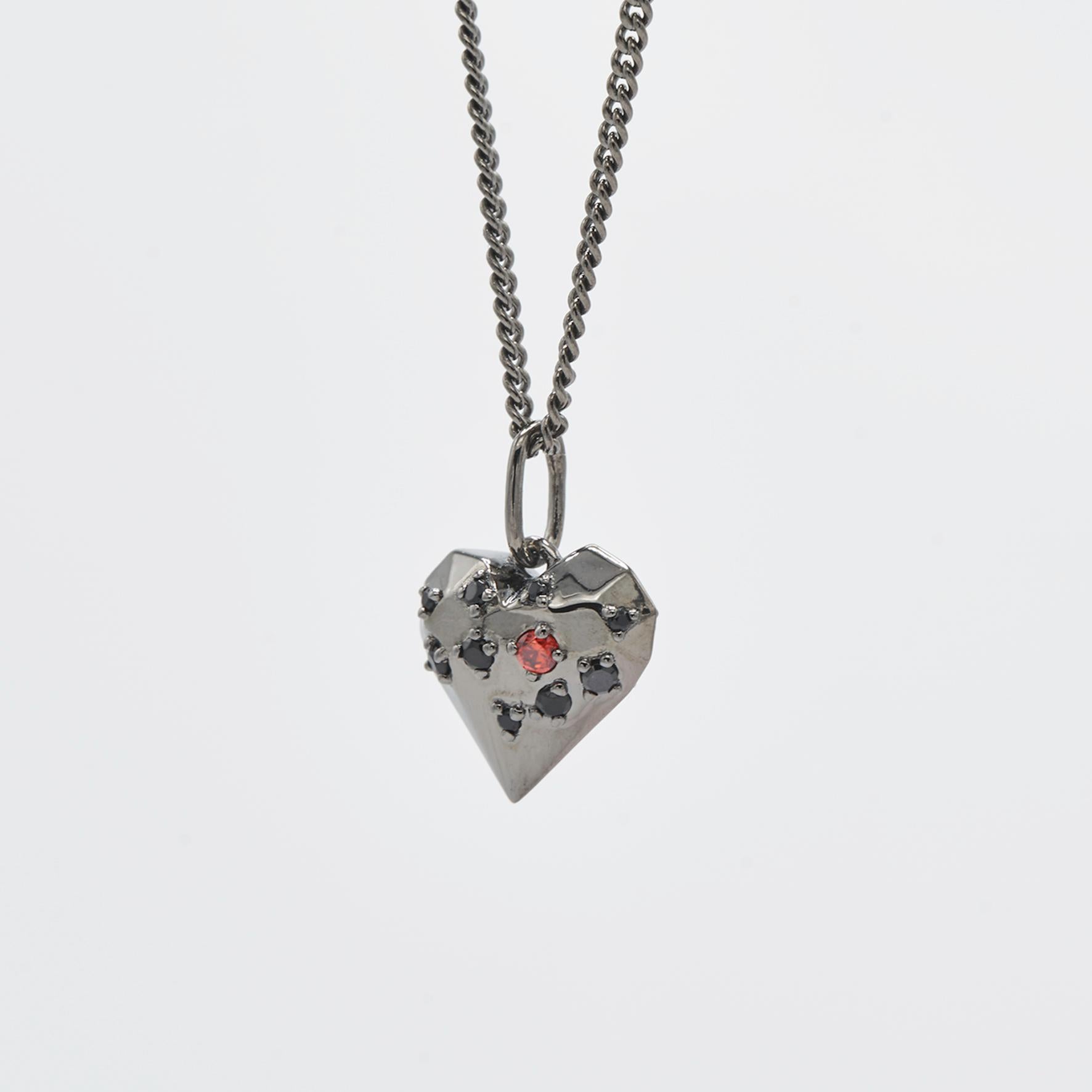 Design-cut heart shape pendant

Dimensions:
10mm x 10mm, chain adjustable           
Composition: 
Sterling Silver black rhodium / cubic zirconia
Sold with chain