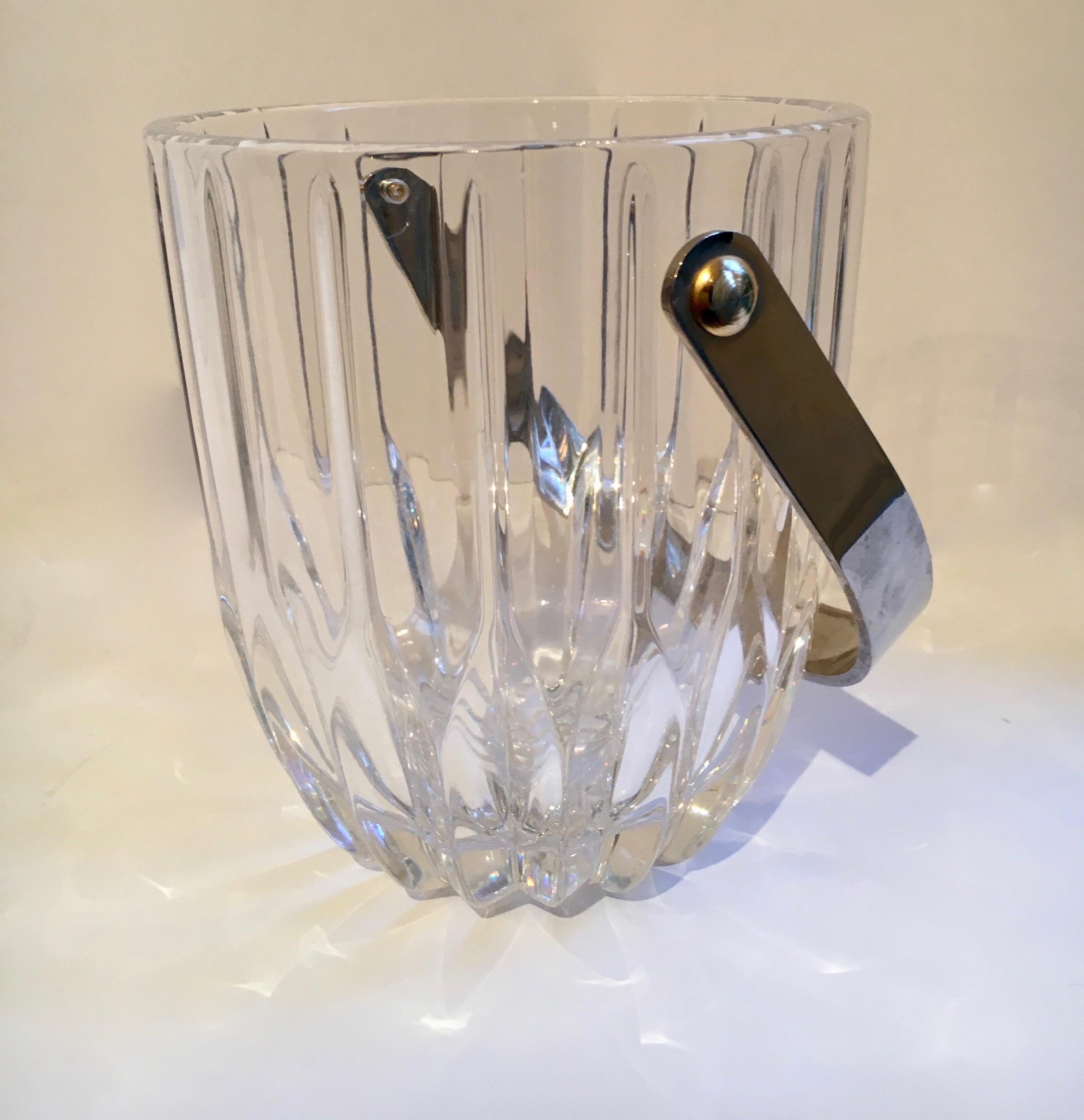Crystal ice bucket with nickel handle - brass rivet detail on side. This is a very handsome and simple ice bucket ready for any bar, bedroom or office!

Elegant and on the smaller side - perfect for ice, but 'could' still rock a bottle of white or