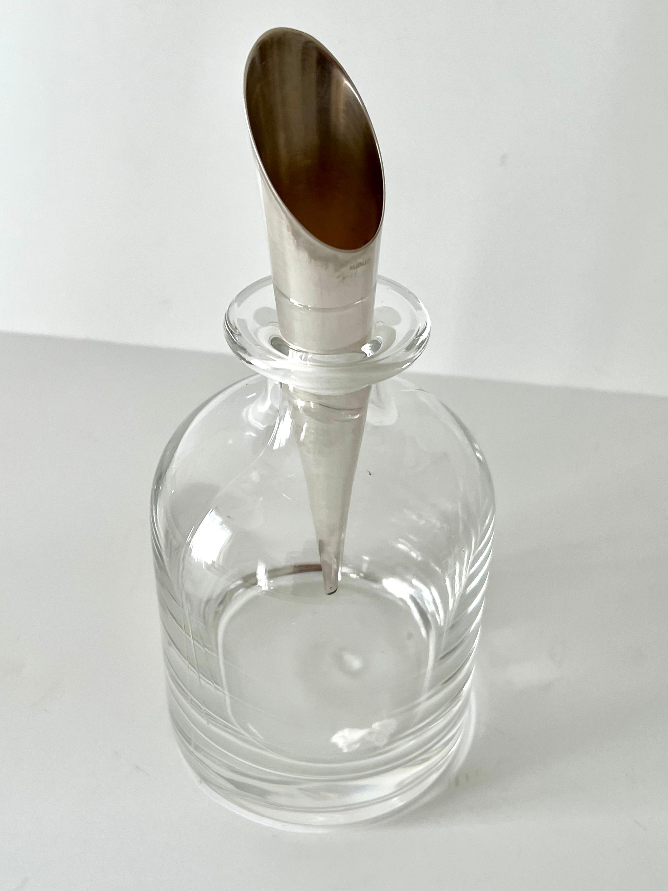 Very hard to find -- Crystal Italian Pampaloni decanter with sterling silver stopper

The one shown has a unique Sterling Silver stopper of a Cone or Funnel, which comes in handy as a bartender... A wonderful decorative element for any room, or