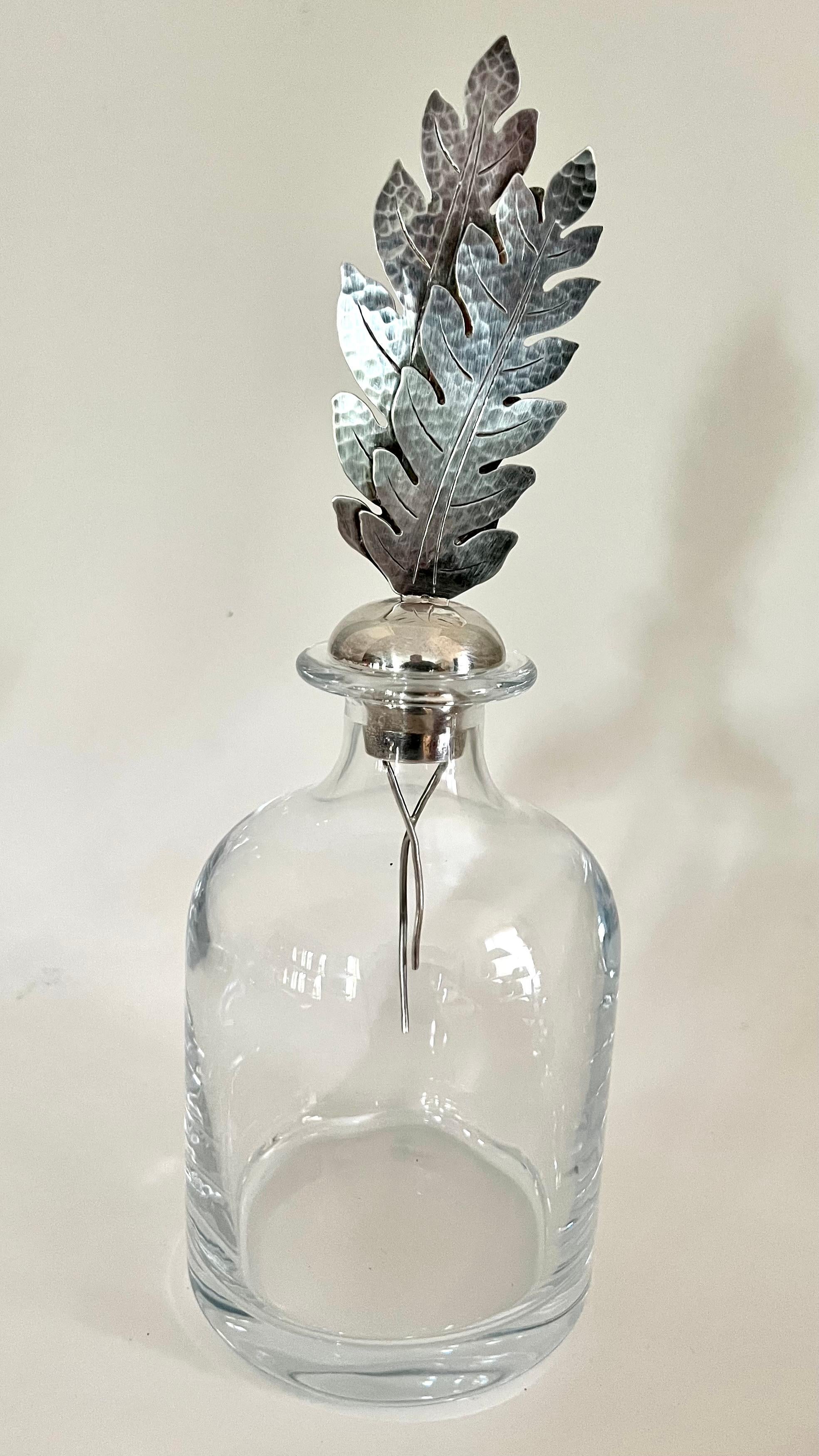 Very hard to find -- Crystal glass decanter with sterling stopper. A great decorative piece for the bar aficionado! ... We have three of these crystal decanter, each with a different and unique stopper - this one has a sterling leaf

Bottles are