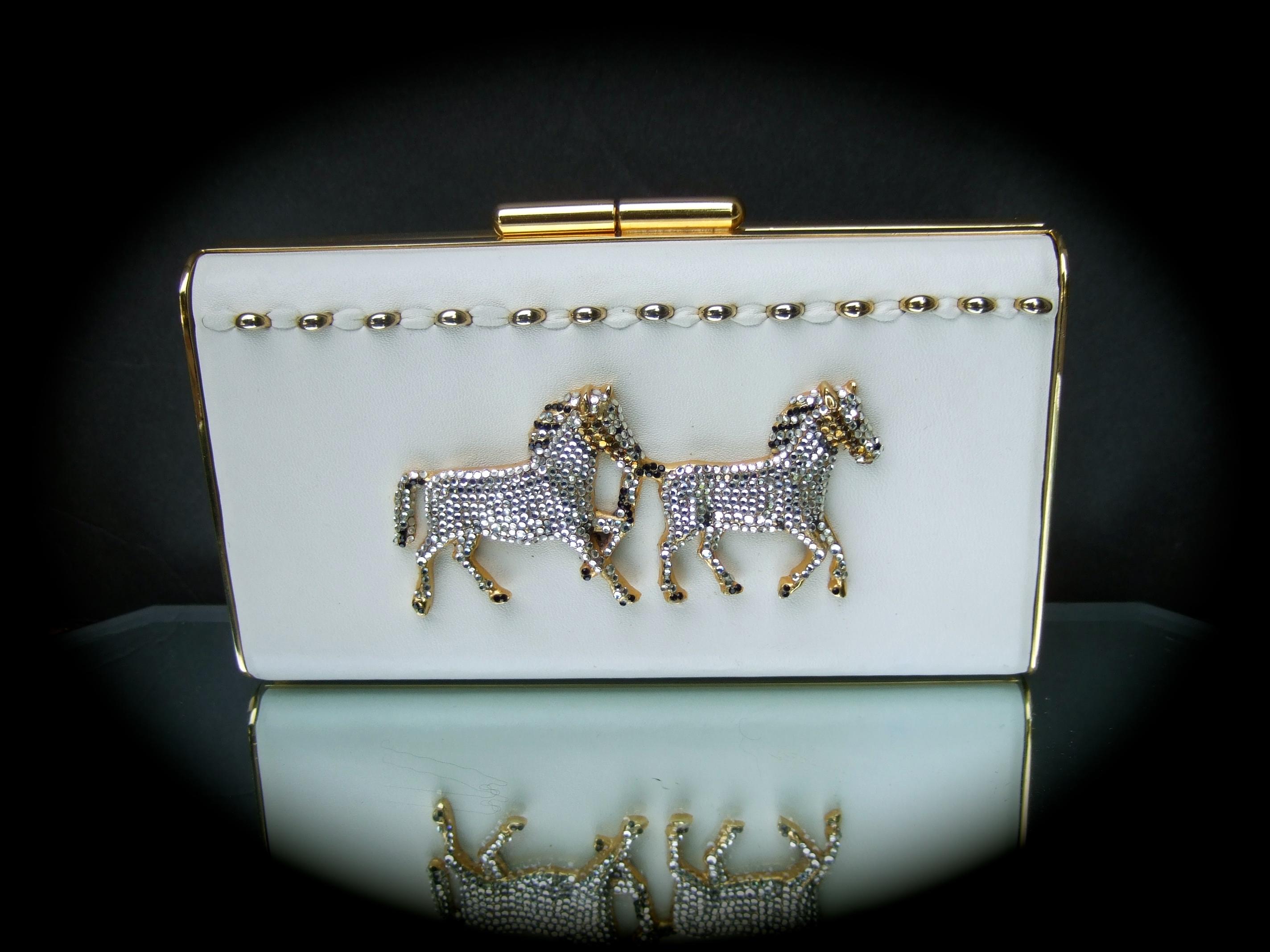 Crystal leather equine minaudiere clutch - shoulder bag by Ermine Beverly Hills 
The  opulent handmade evening bag is designed with a pair of diamante' crystal 
horses mounted onto a creamy bone color leather backing 

The evening bag is constructed