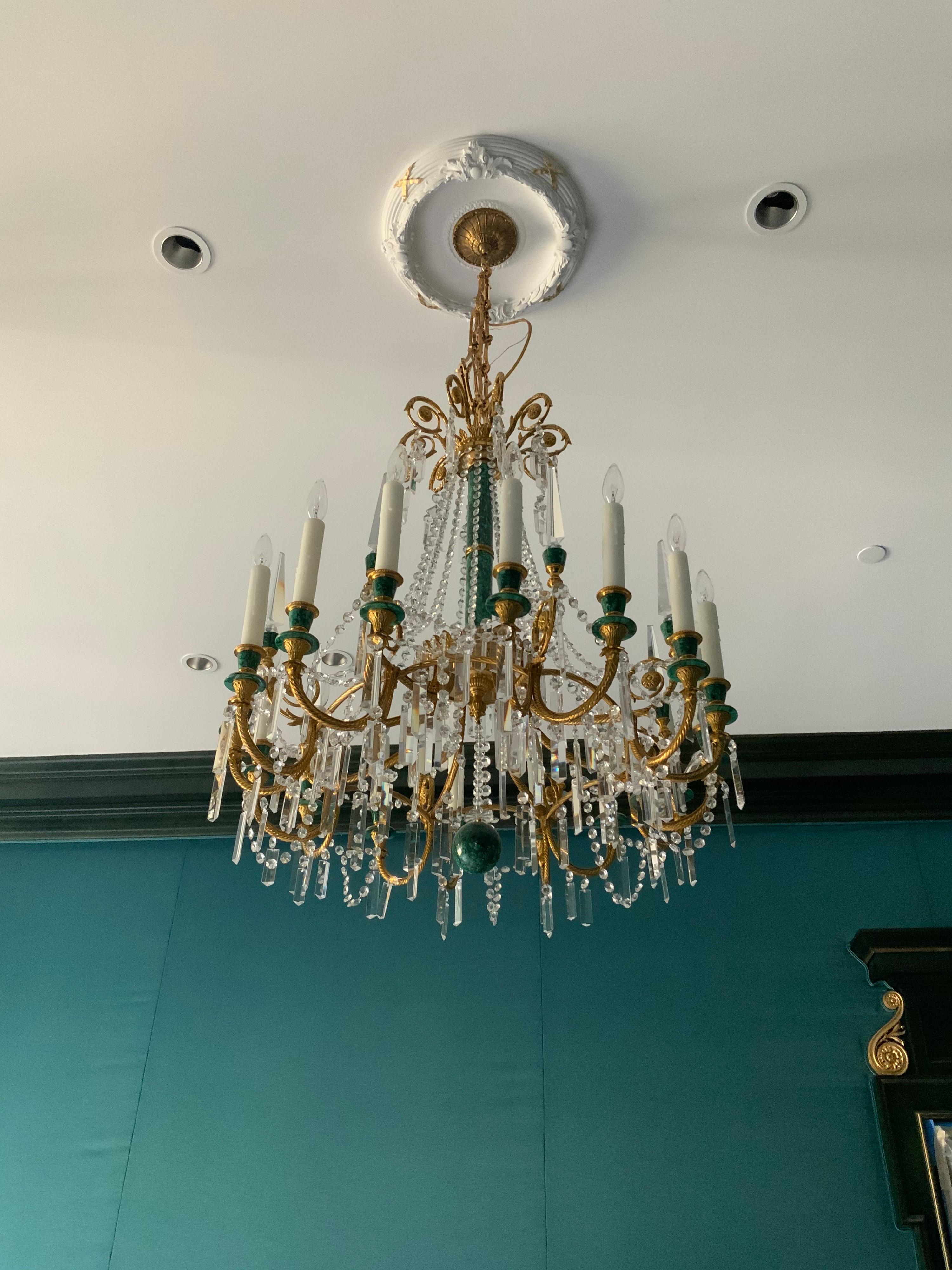 This majestic chandelier is made of crystal and malachite.

It origins from France, circa 1990.