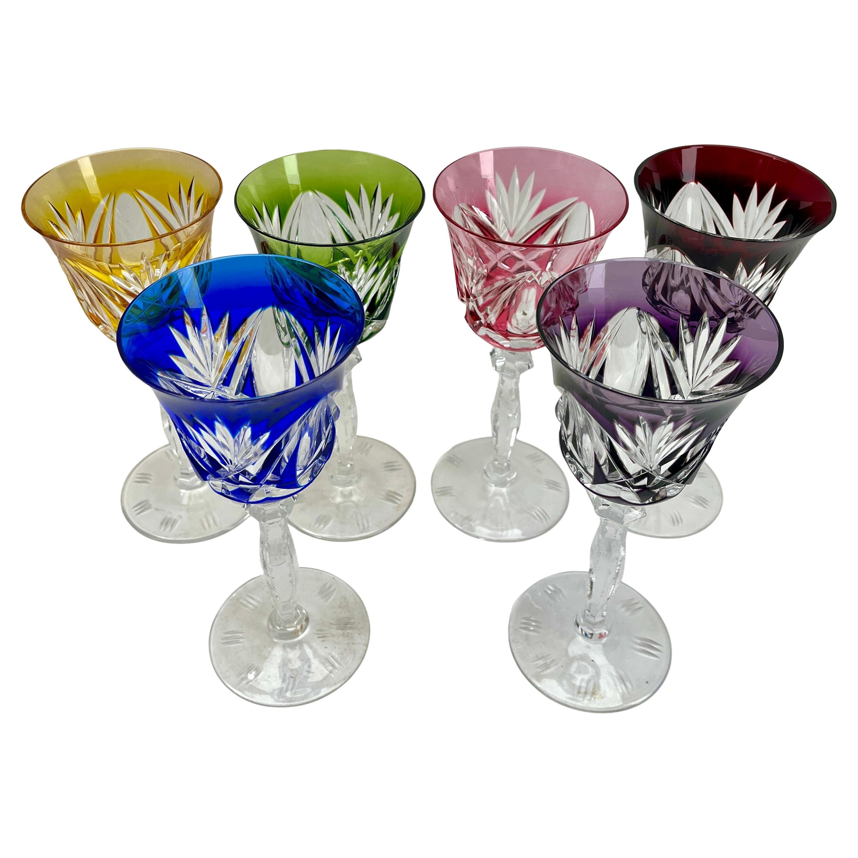 Vintage mix set of 6 cut to clear crystal stem glasses.

Mix crystal (Bleikristall 24% Mundgeblasen Handgeschliffen) glasses

Clear crystal glass. Side facetted and toothed stem. 
The bowl with colored overlay cut to clear. 
In best