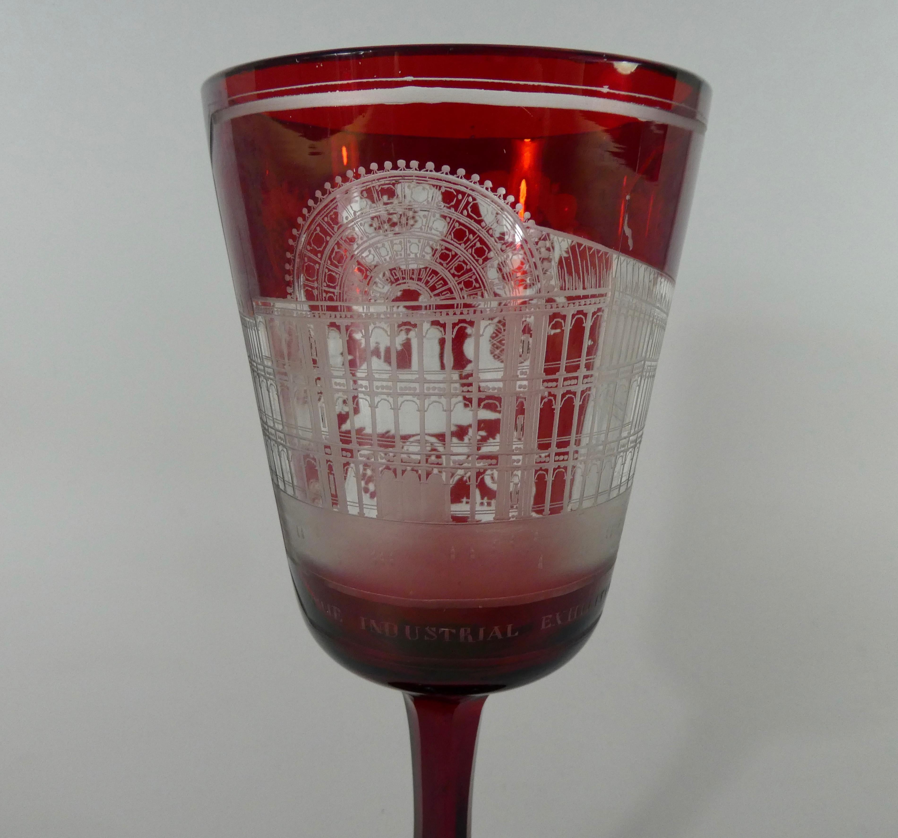 Bohemian glass goblet, dated 1851. The ruby glass made to commemorate The Industrial Exhibition for 1851 at the Crystal Palace, Hyde Park, London. Engraved to the front with a detailed view of the Crystal Palace. The reverse with a building