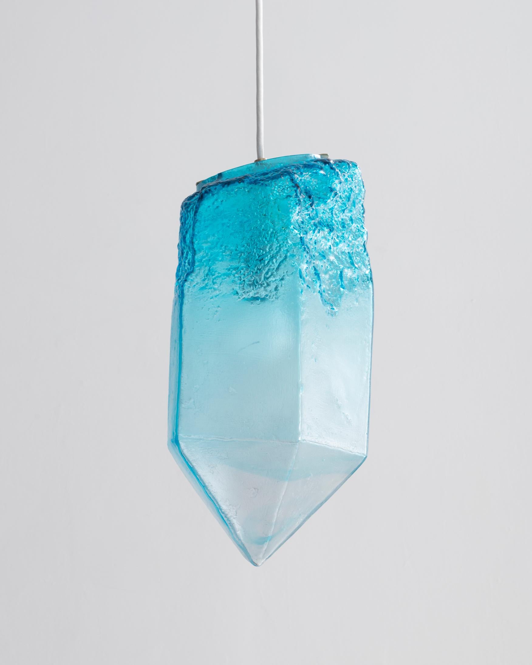 Crystal illuminated sculptural pendant in hand blown turquoise glass. Designed and made by Jeff Zimmerman, USA, 2016.
      