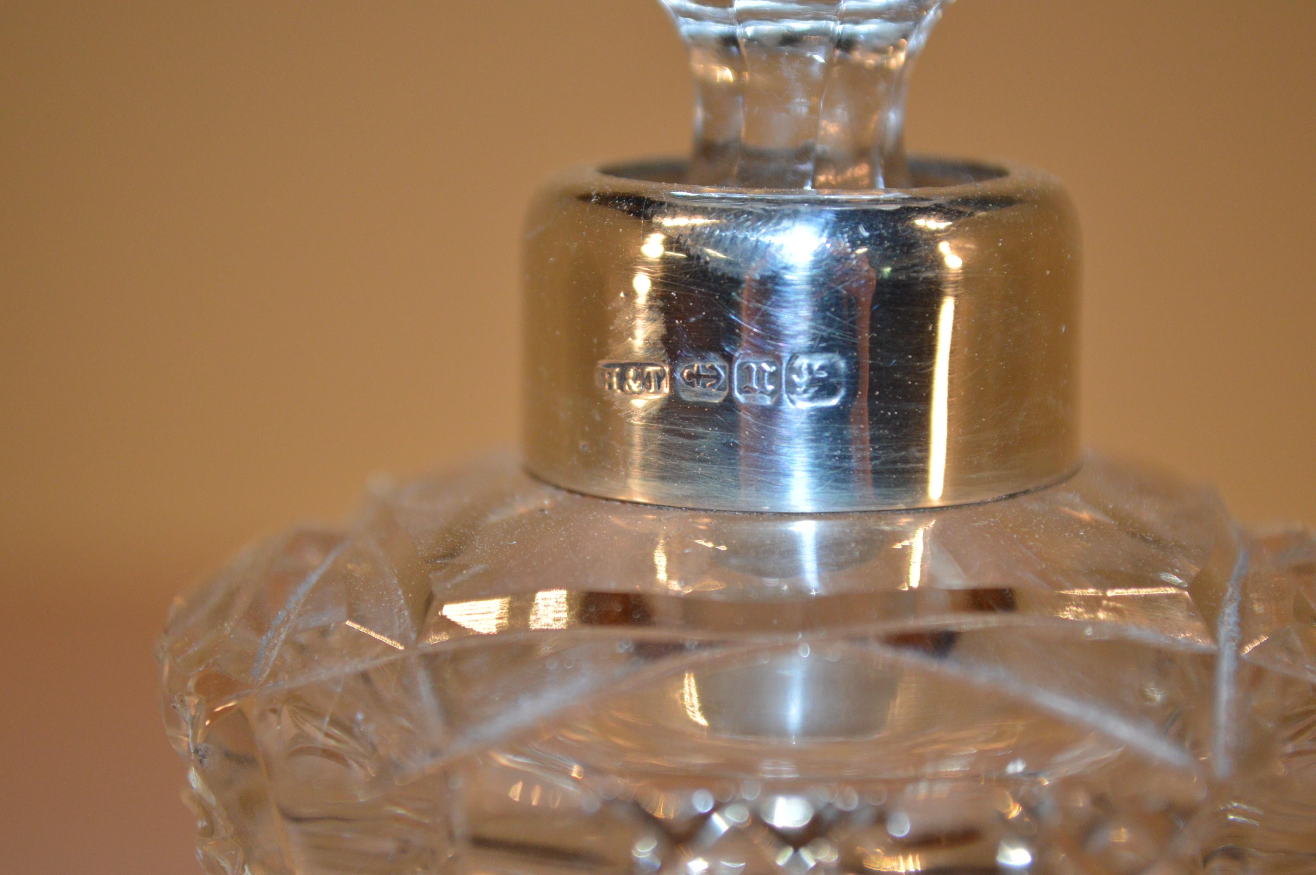 Hilliard & Thomason cut-crystal perfume bottle with a hallmarked sterling-silver collar, circa 1895.