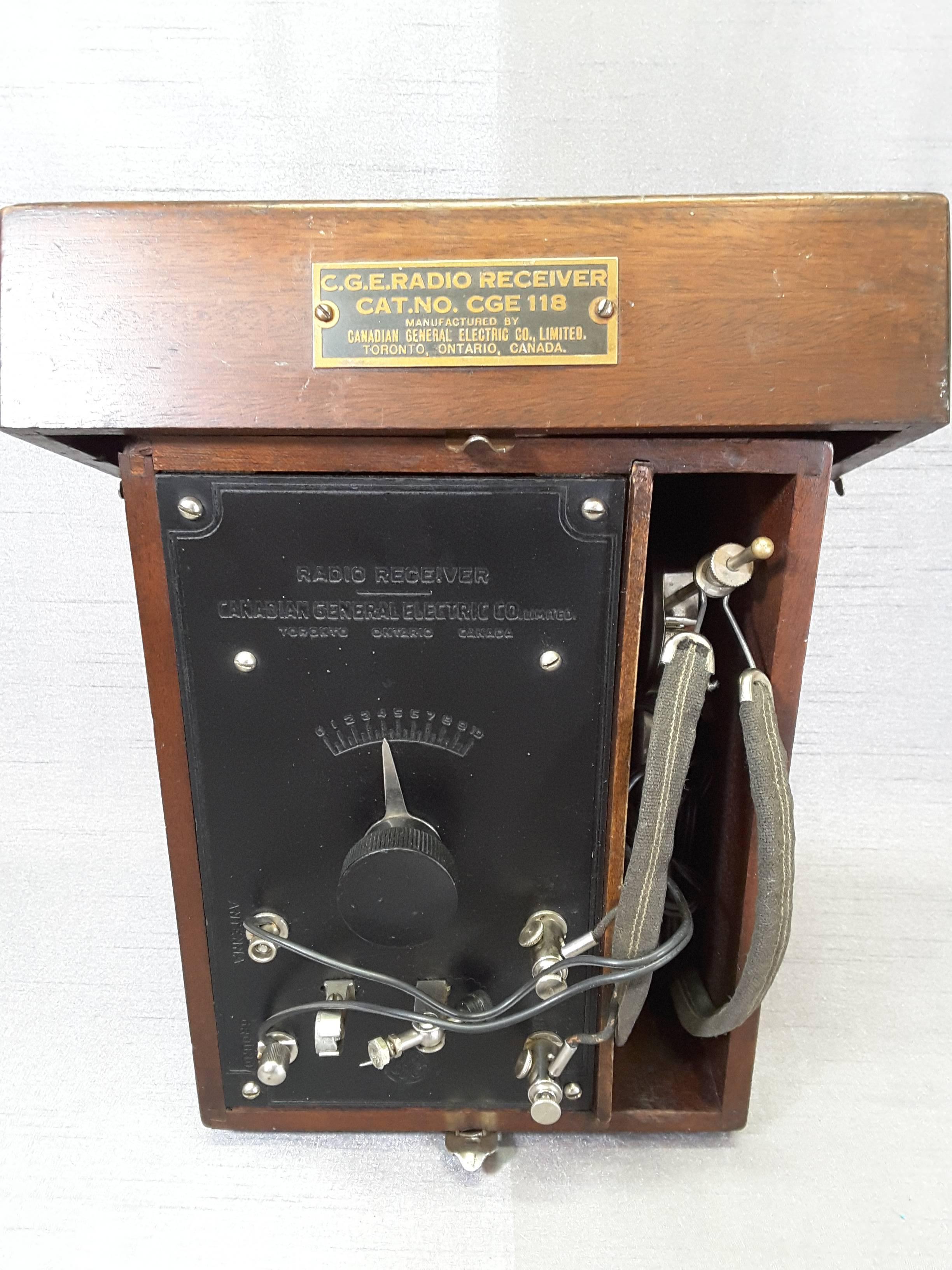 Crystal Radio Receiver number 118 by CGE. Co. Ltd. Circa 1929-1935, Made in Canada, by Canadian General Electric Co. Limited, Toronto Ontario, Canada. The receiver is cased in a mahogany fitted box, The radio has all dials, wires and original