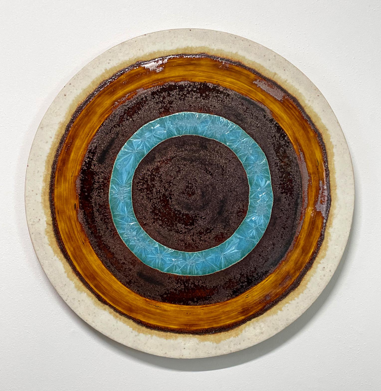 Crystal Revolution
Ceramic painting by William Edwards
Hand rolled earthenware circular slab glazed in amber and turquoise crystals. 

William received his BFA in sculpture from the historic San Francisco Art Institute and his MFA from UC Davis.