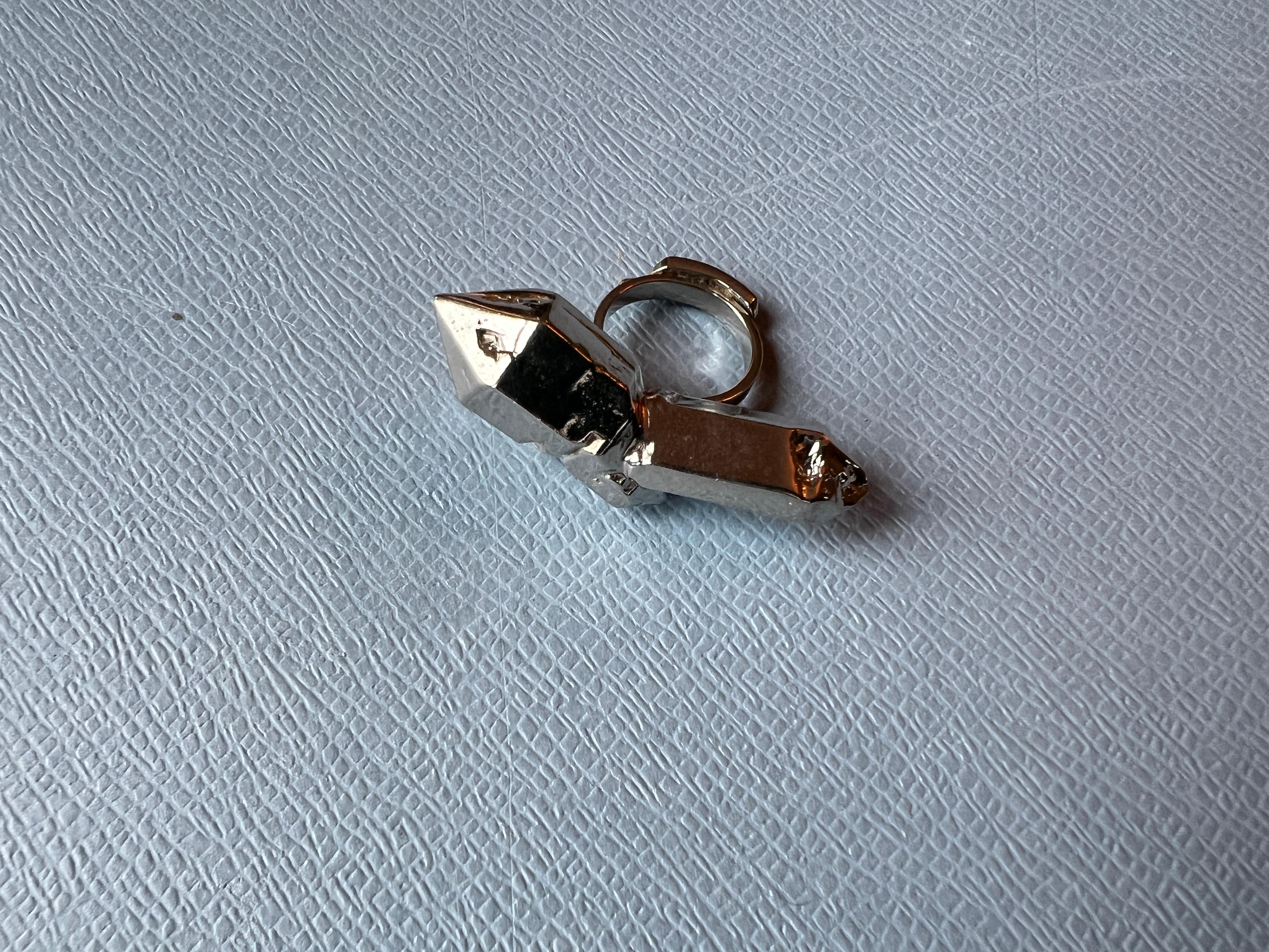 Crystal Ring Palladium Plated Vintage 

Size: US 5 1/5 
Length of Crystal ( made in metal ) is 2 inches

J Dauphin, founded in 2006 by Johanna Dauphin, is a brand synonymous with luxury, sustainability, and a rock 'n' roll spirit. The designer, with