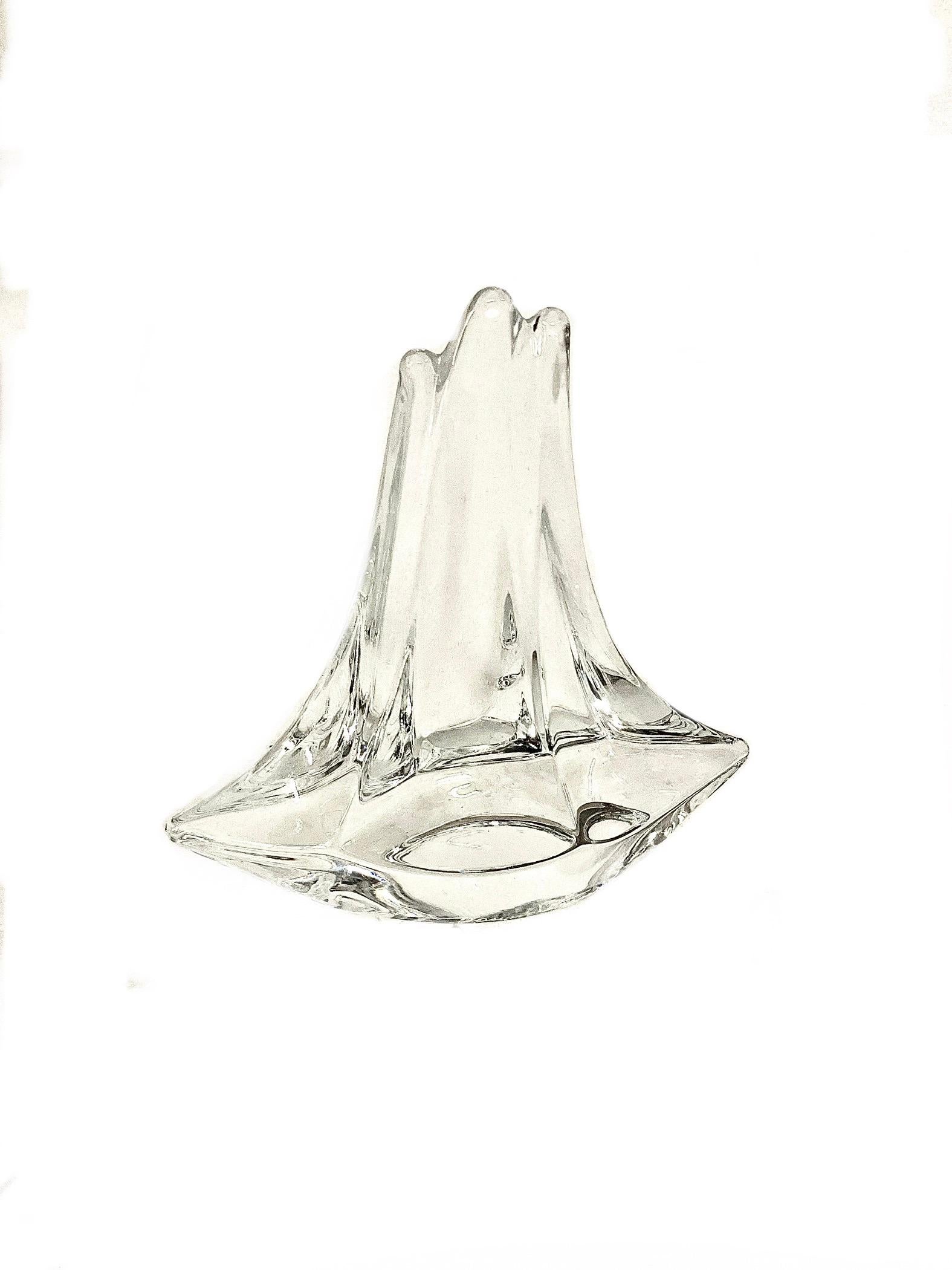 An intriguing crystal ornament, or paperweight, in the shape of a stylised three-masted sailing boat, made by legendary crystal manufacturer DAUM France. In excellent condition, its sparkling clarity and abstract lines capture and reflect the light