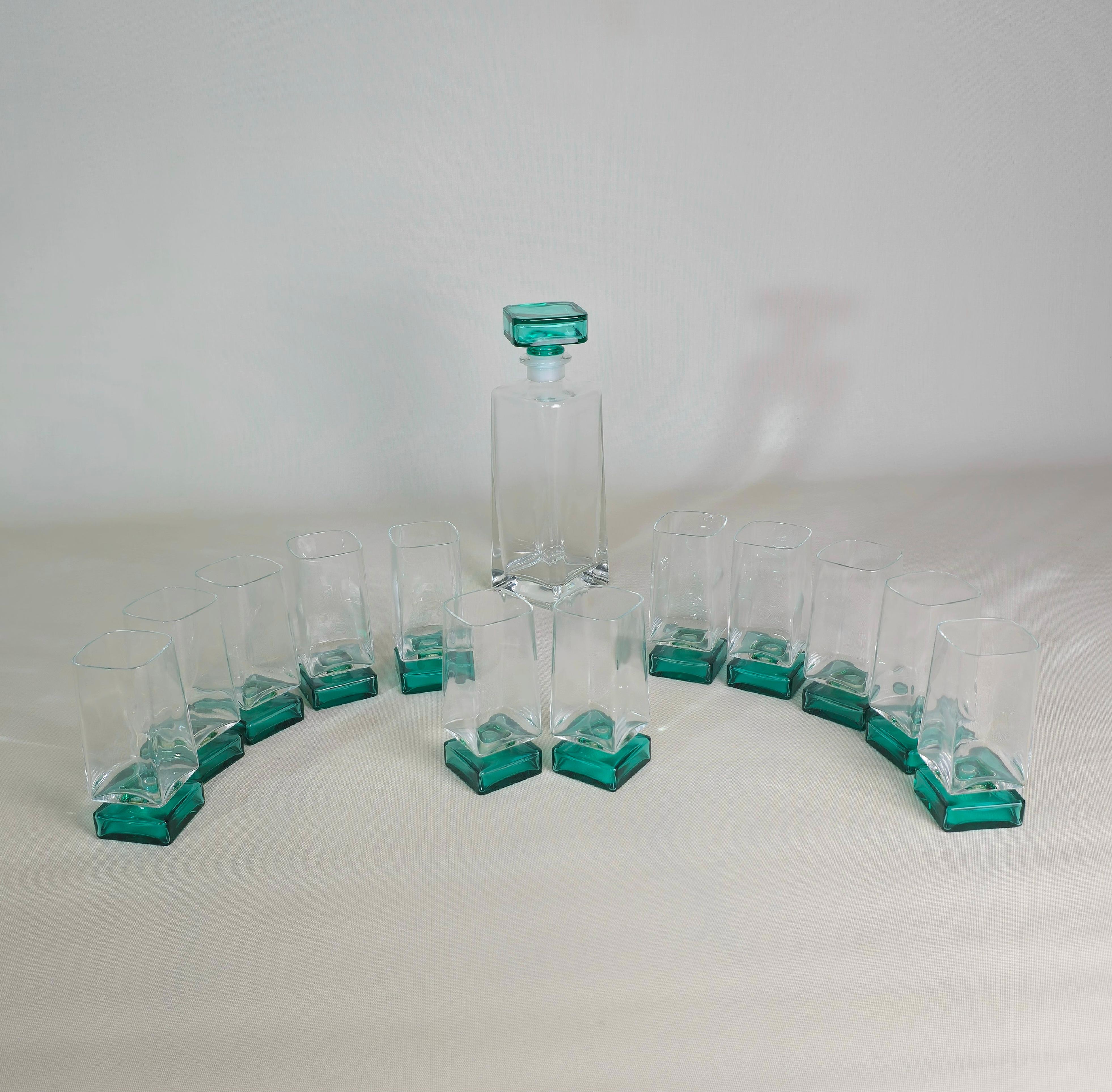 Set of 13 pieces made of transparent and bottle green crystal. Composed as follows: 12 liqueur glasses and 1 liqueur bottle. Made in Italy in the 90s.



Note: We try to offer our customers an excellent service even in shipments all over the world,