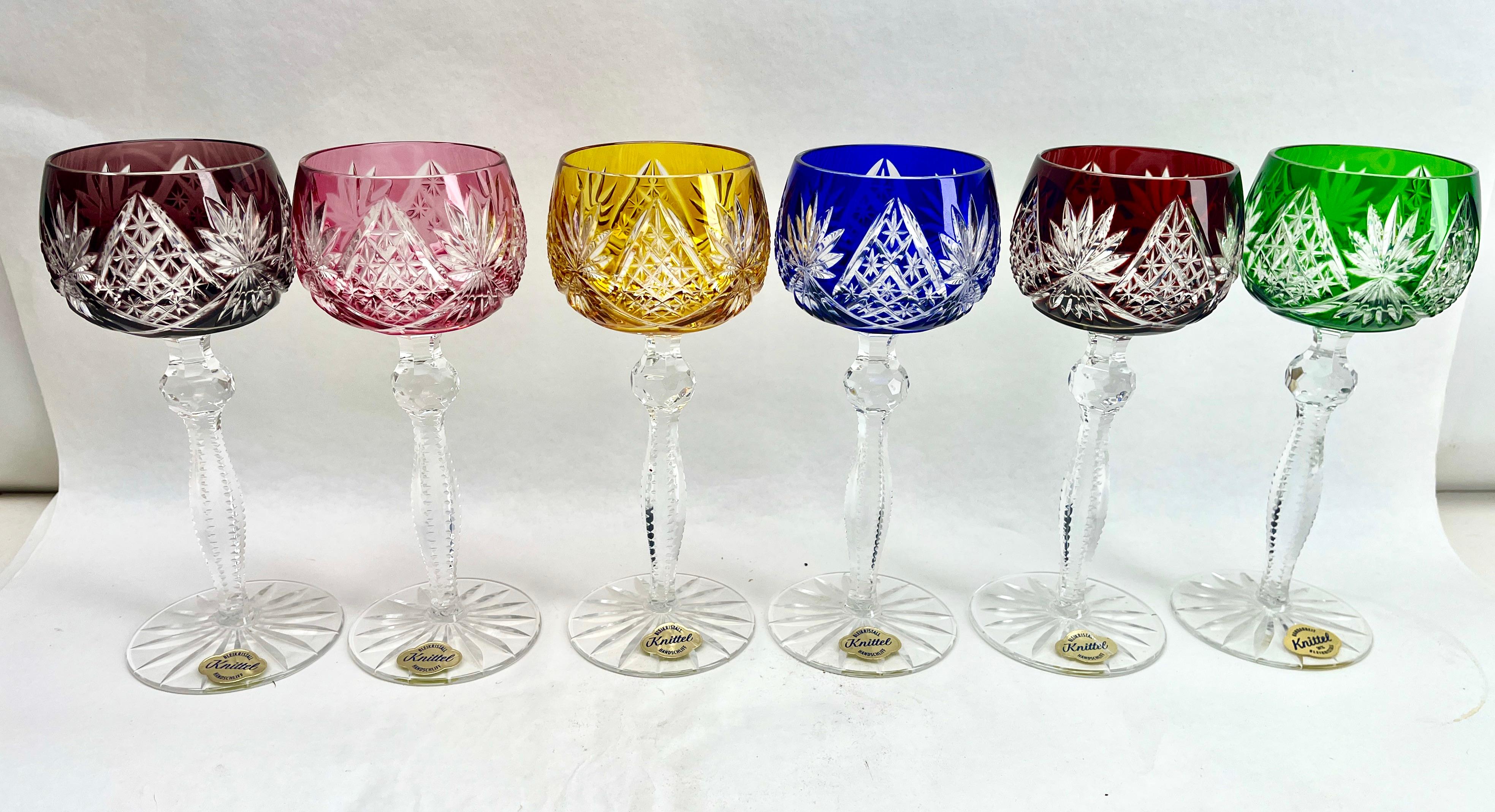 Vintage with Label Knittel set of 6 cut to clear crystal stem glasses.
Mix crystal (Bleikristall 24% Mundgeblasen Handgeschliffen) glasses

Clear demi crystal glass. Side facetted and toothed stem. The bowl with a colored overlay cut to clear.
In
