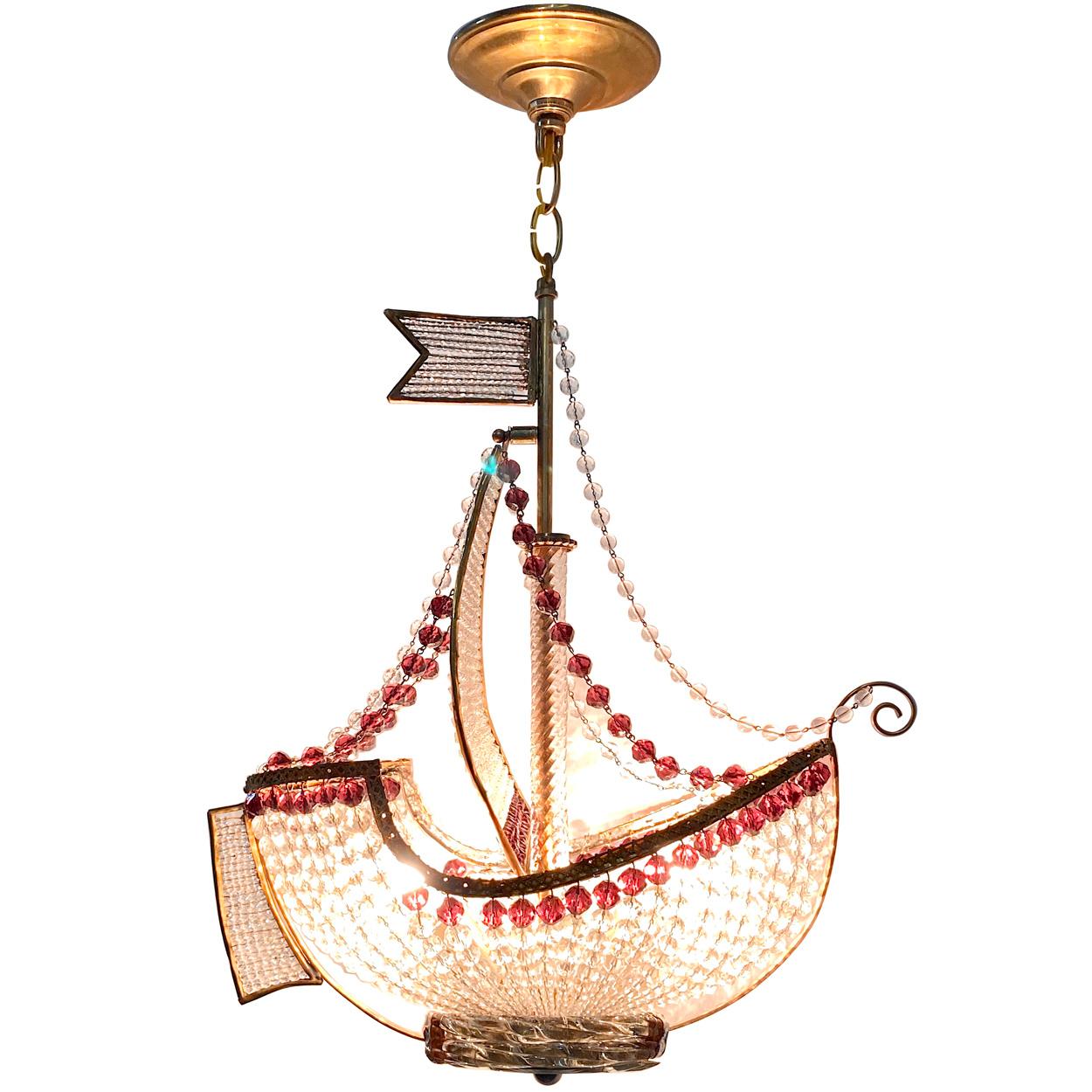 A circa 1930s French ship shaped chandelier with amethyst beads and beaded crystal body.

Measurements:
Height of body 21? (min. drop)
Depth 7.5?
Width/length 17?