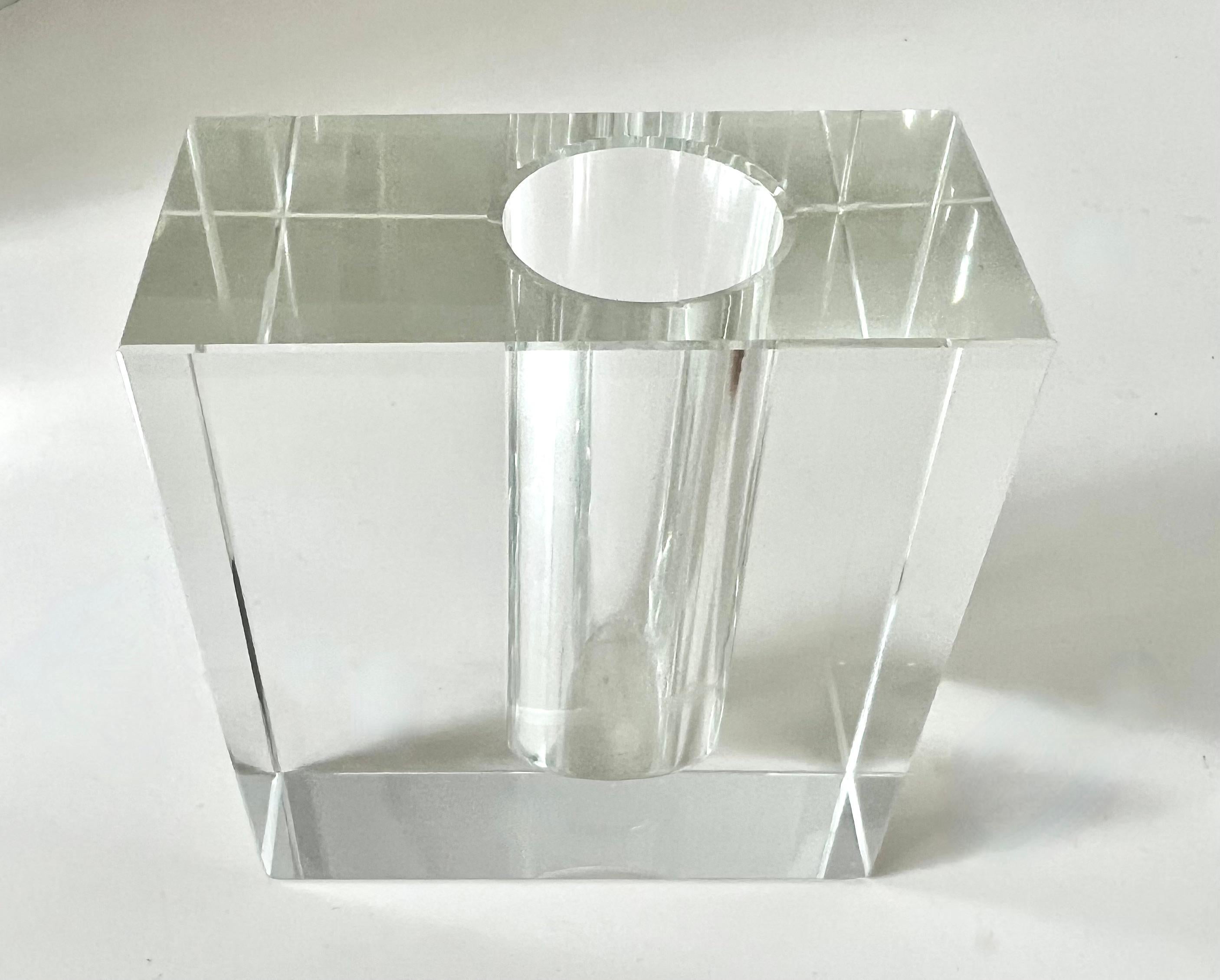 A simple, yet purely elegant and Architectural bud vase of solid crystal with a hole bore offset to hold a bud.

The form is the look here and the simple lines make this a hit with or without a bud inside.

A wonderful piece for the desk or work