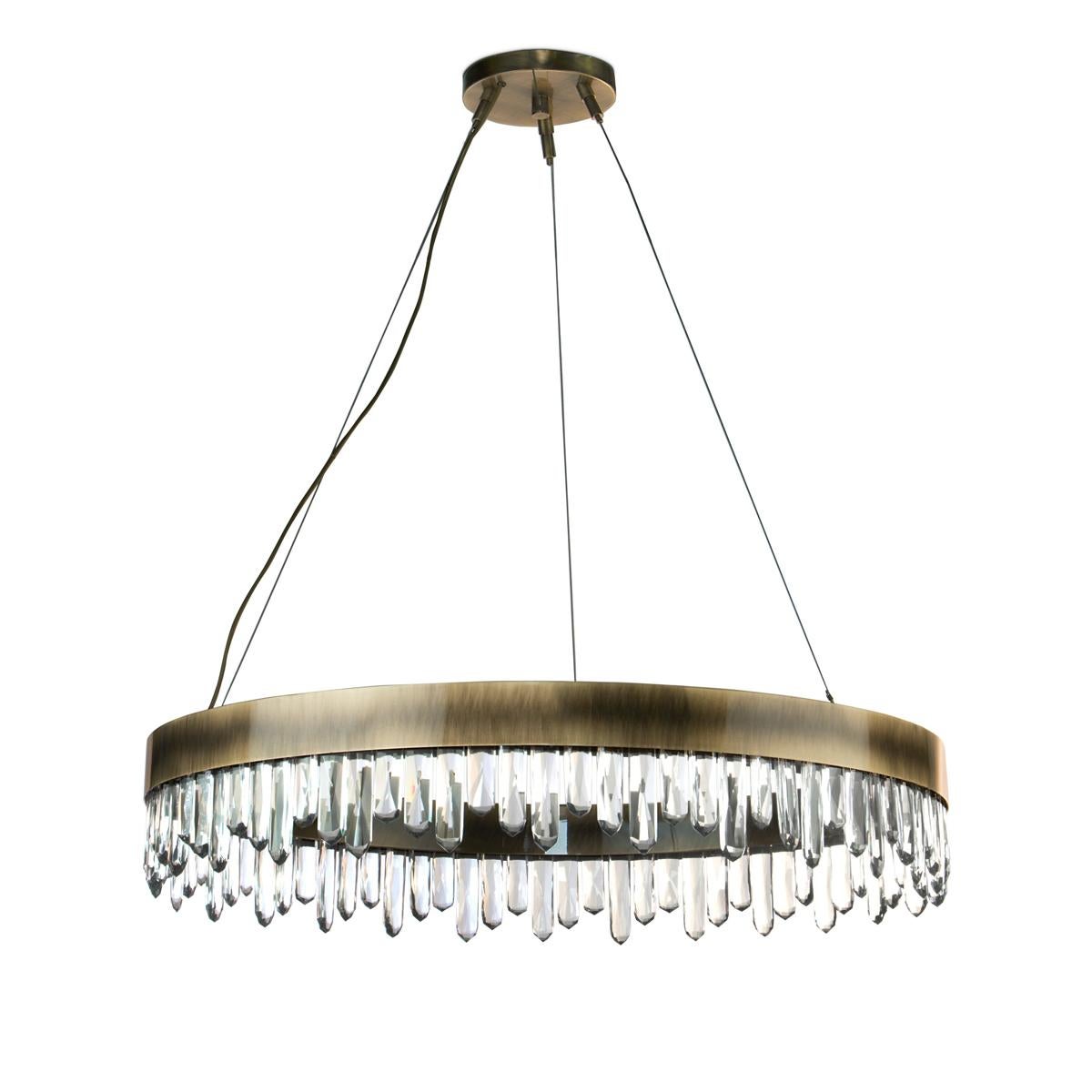 Chandelier crystal sticks with carved quartz crystal sticks.
Structure in solid brass in antique brushed finish.
With Led light included inside the ring structure.