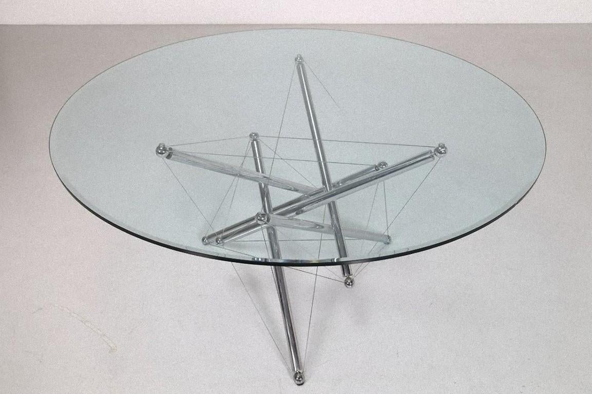 This crystal table is a design furniture designed by Theodore Waddel and produced by the Italian Company Cassina in 1973.

Table model 713 made of chromed metal and cut crystal. The table has six legs, three of which are suspended - supporting the