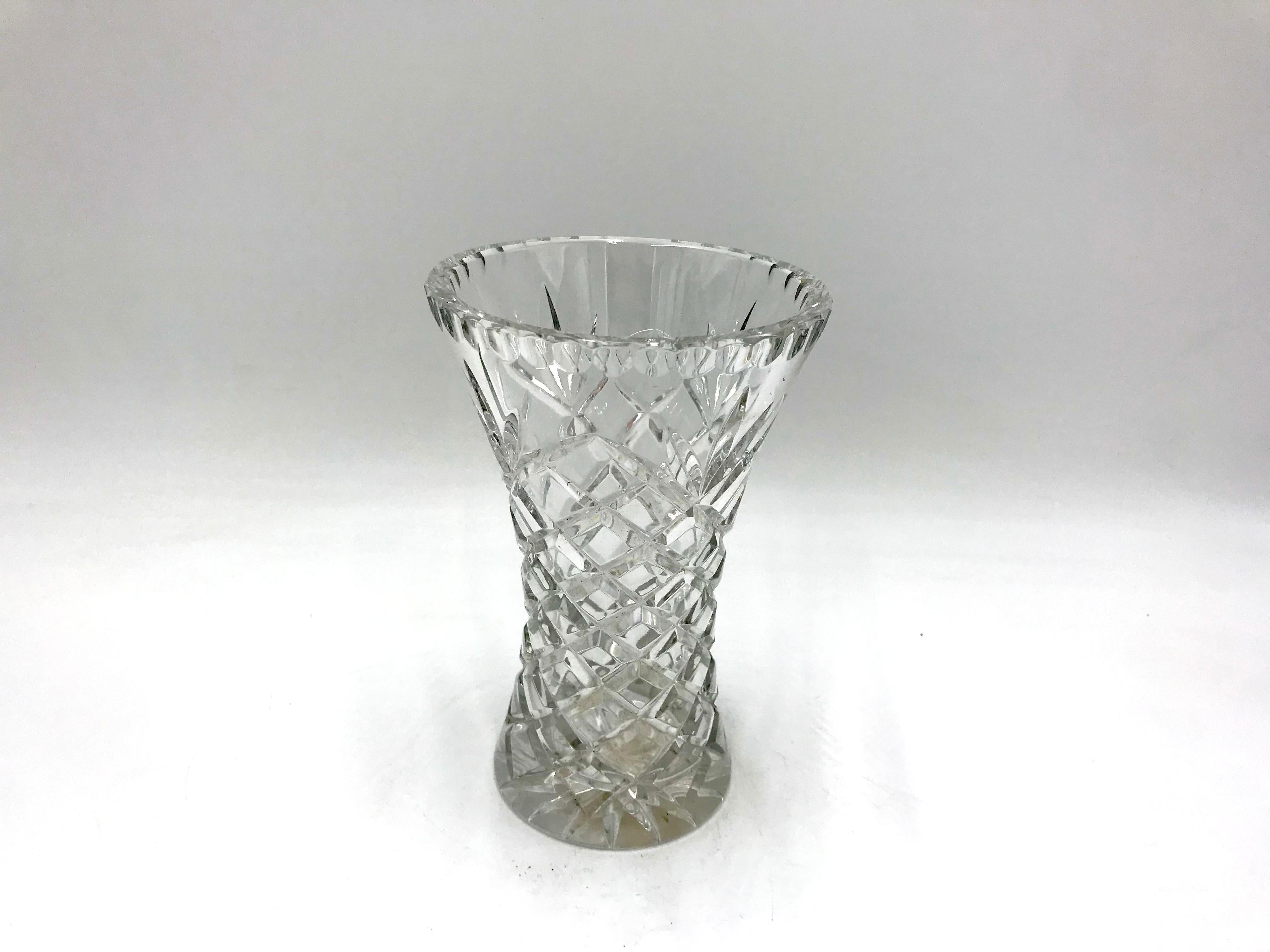 Vase made of crystal. 
The vase was produced in Poland in the 1960s and 1970s.
Vase in very good condition
Measures: Height 18cm / diameter 12cm.