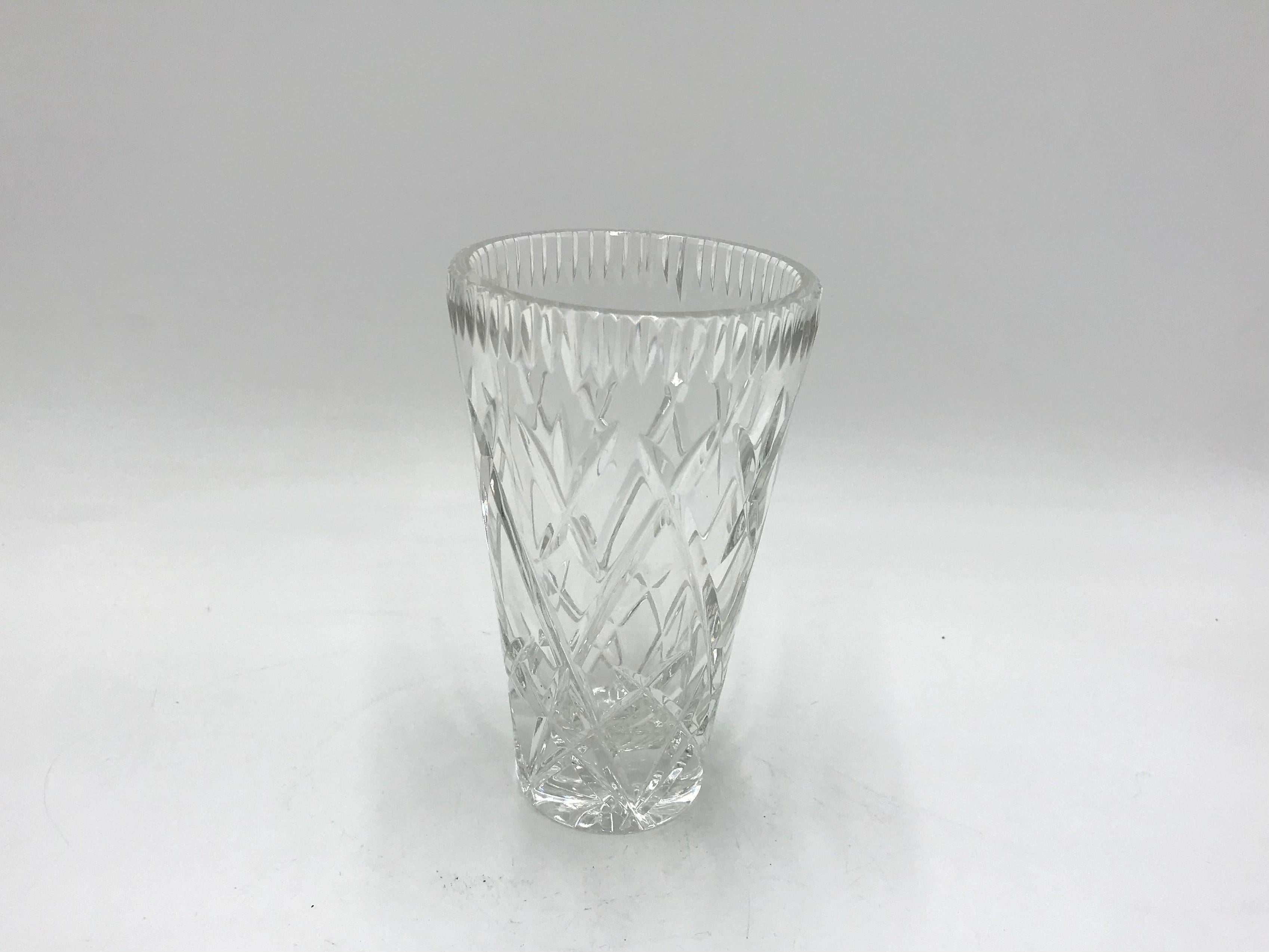 Vase made of crystal. 
The vase was produced in Poland in the 1960s and 1970s.
Vase in very good condition
Measures: Height 16cm / diameter 9cm.