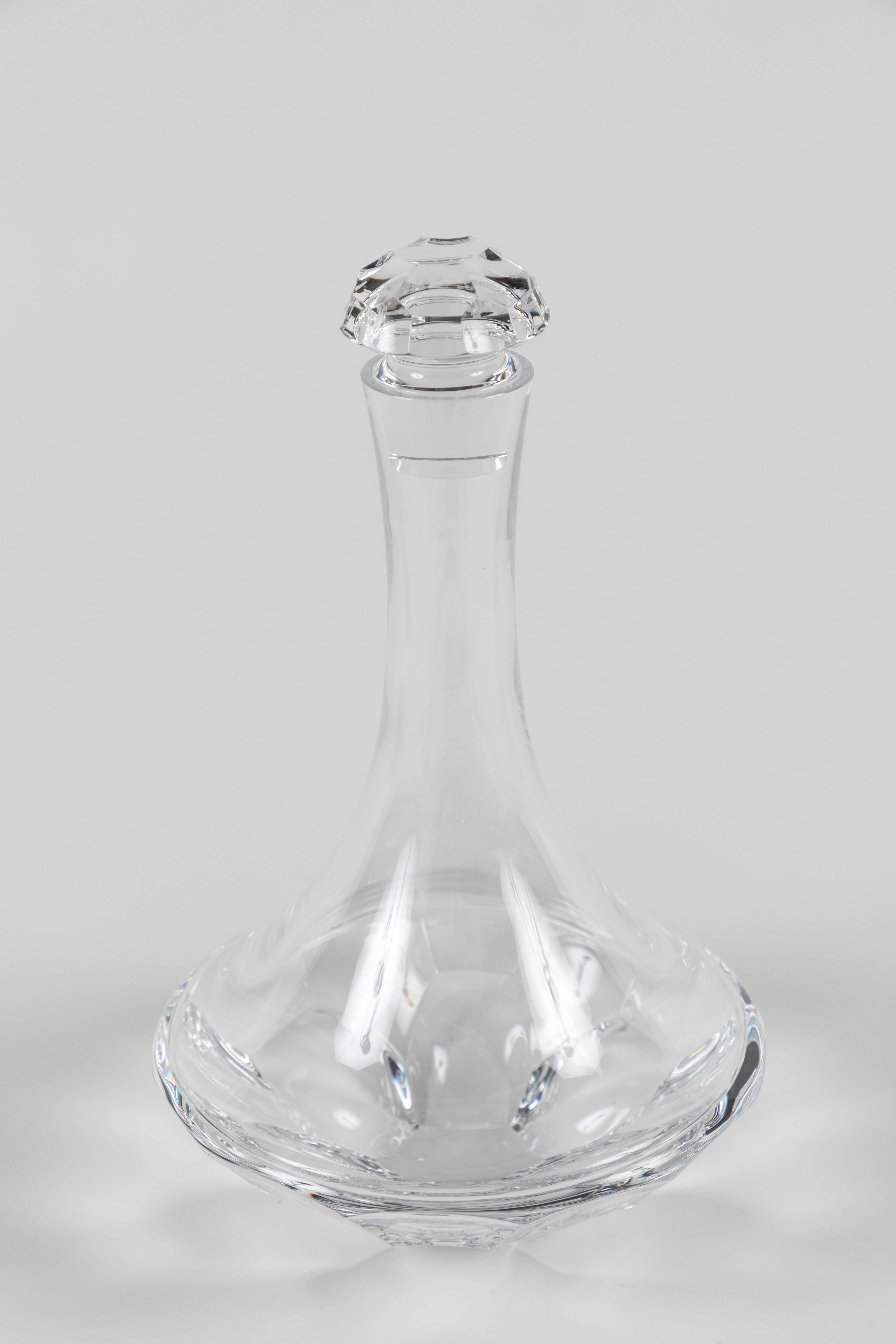 Designed by Ted Muehling in 2007 The Tortoise Decanter has a graceful, arcing shape like that of a traditional ship's decanter, with a wide base that lets the wine breathe, made with fine lead crystal for which Steuben is known. Retains the Steuben