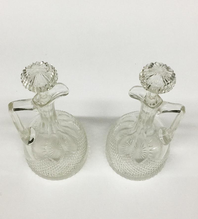 Crystal jug decanters with Diamond Cut crystal, 1890

A set of 2 small table crystal jug decanters with diamond cut crystal
The bottles each have a stopper
Dutch cut crystal circa 1890
The measurements of the crystal jugs are 25 cm high and 10 cm
