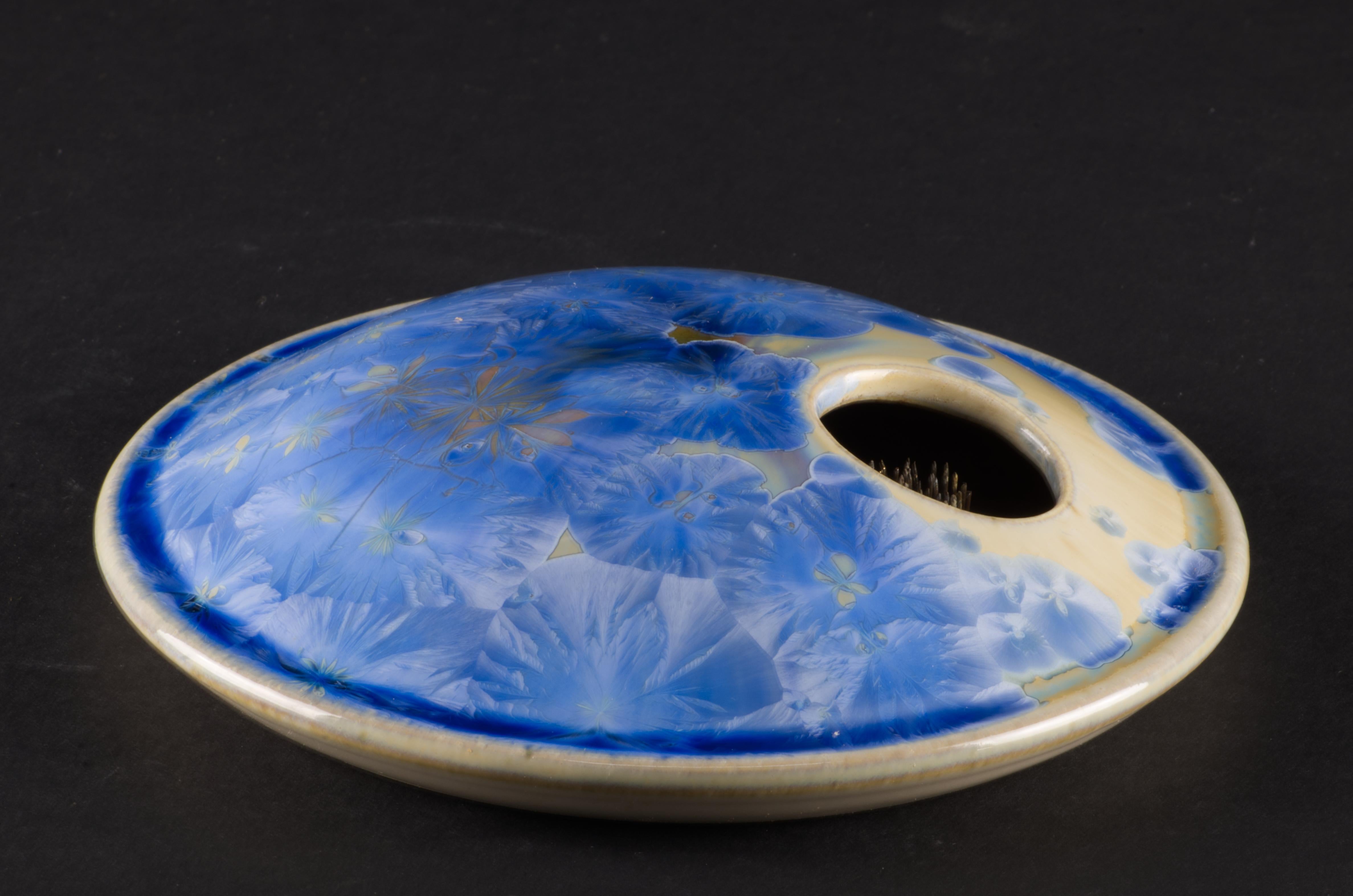  The vintage studio pottery ceramic ikebana vase is decorated with crystalline glaze in striking, bright blue and yellow palette. The vase was hand thrown on a wheel; blue color crystals on muted yellow colored base were grown in a kiln during a