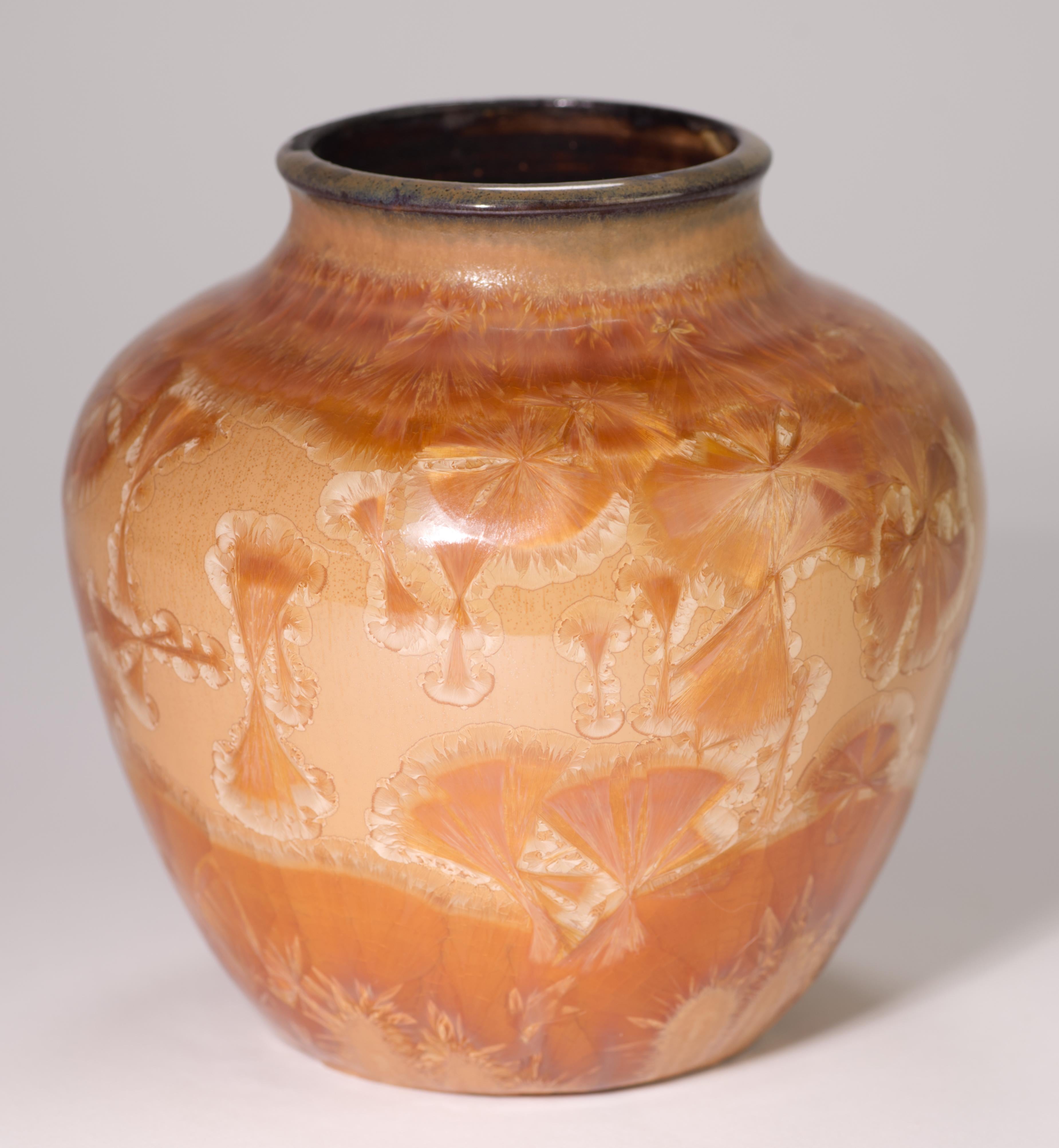  Striking studio pottery ceramic bud vase is decorated with crystalline glaze in bright, but harmonious tones. Deep burnt orange crystals on creamy light orange colored background were grown in a kiln during a very long, controlled firing. Each