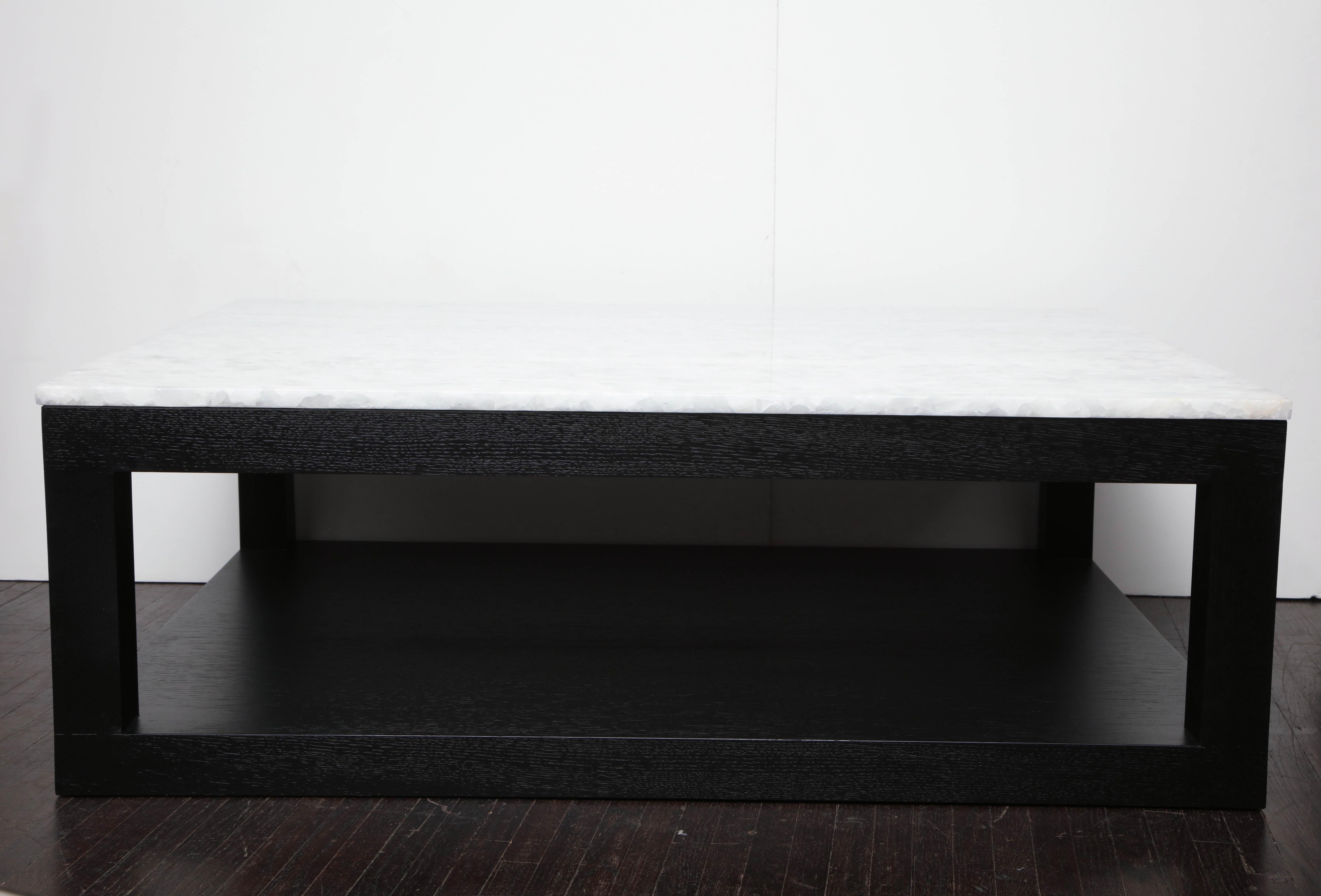 Custom crystallized quartz coffee table with ebonized wood base. Customization is available in different sizes, base finishes and quartz tops.