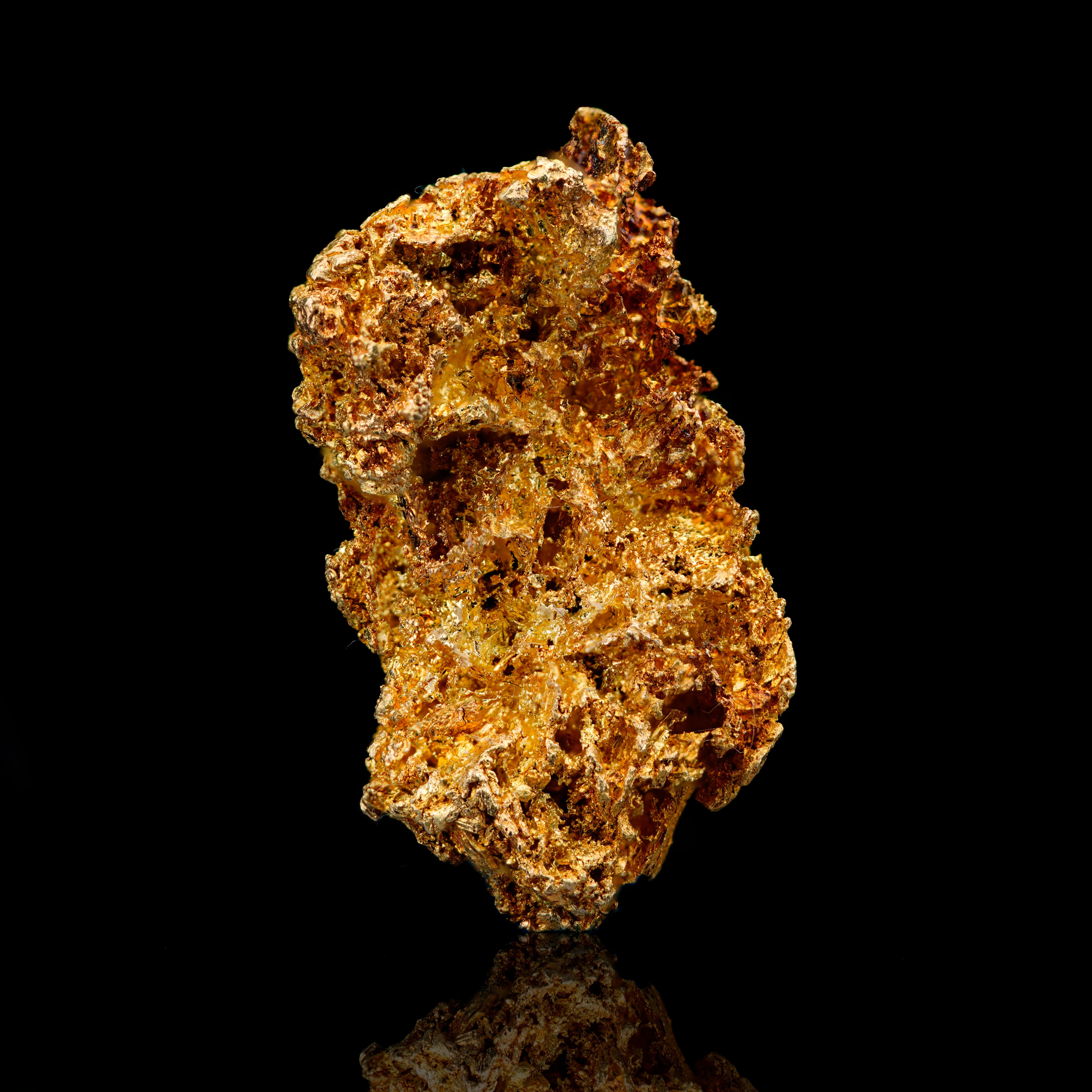 This natural Crystallized Gold specimen from the famed Mockingbird Mine in California exemplifies the sculptural beauty of Crystallized Gold. Rising in an elegant, vertically elongated form, this specimen displays richly detailed surface textures