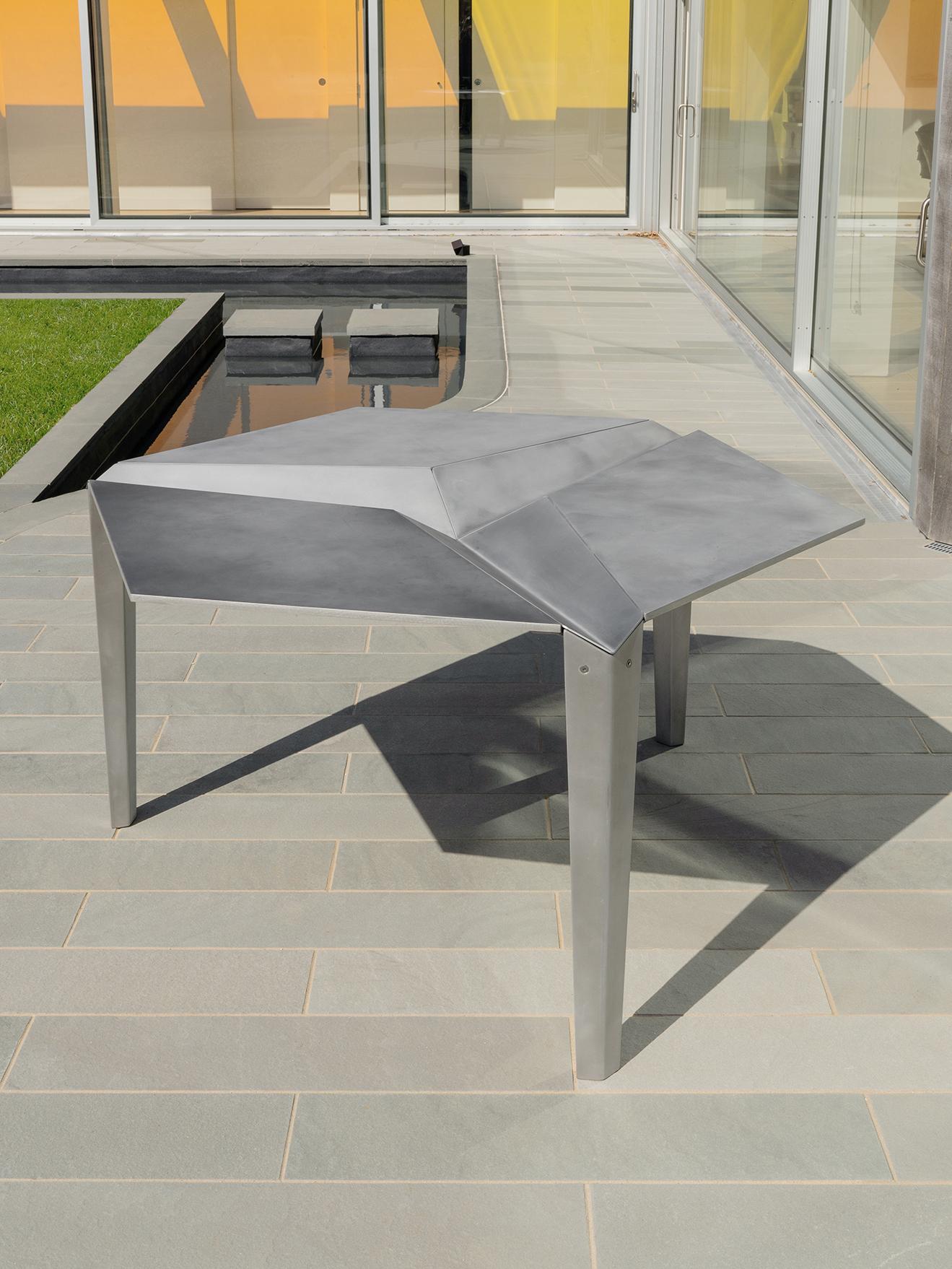 CRYSTALLIZED TABLE

Lightweight Indoor/outdoor dining table for six people, also available in cocktail size. The intent of the dining set is to resemble origami, which suits the manufacturing process of bent metal. NEA Studio worked closely with