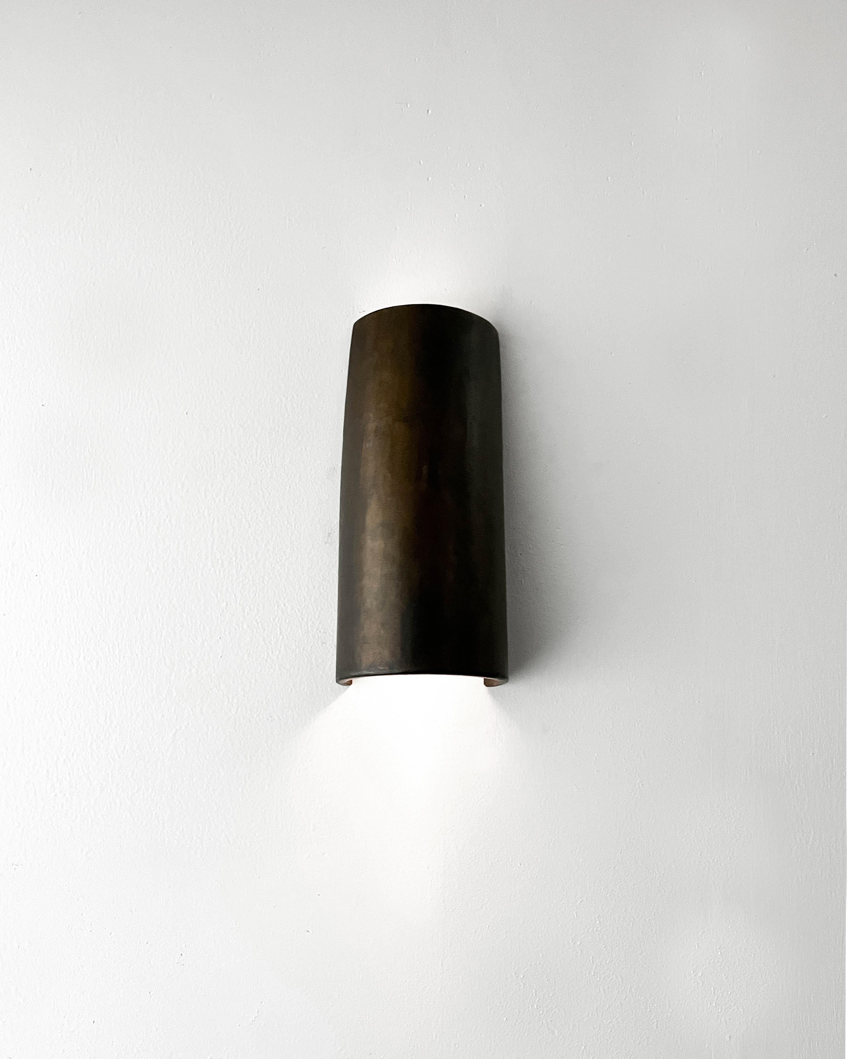 CS Sconce by Cal Summers
Dimension:  W 23 x D 11 x H 8 cm
Materials: Patinated Steel.

All our lamps can be wired according to each country. If sold to the USA it will be wired for the USA for instance.

Cal Summers is a British designer who makes