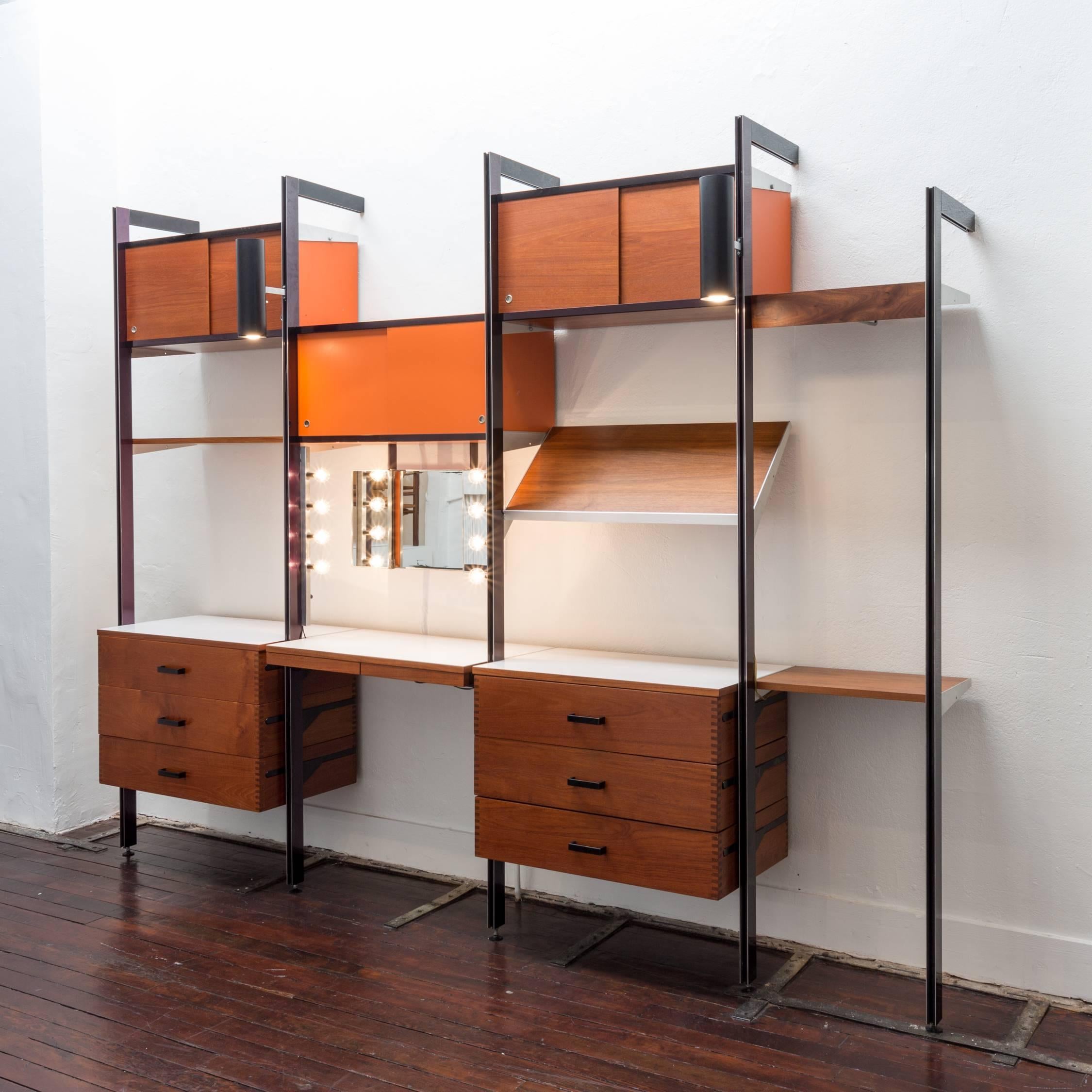 A rare CSS wall unit with residential modules, designed by George Nelson and produced by Herman Miller. The unit has four bays, including a prototype 18