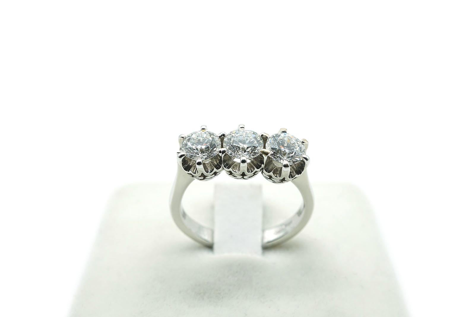This trilogy vintage ring is made in 18 Kt white gold ( gr. 5.35 ).
It is set with three brilliant cut diamonds for a total weight of Ct 1.52.
Size 7. 
This ring can be resized.
The stone certificate is available.