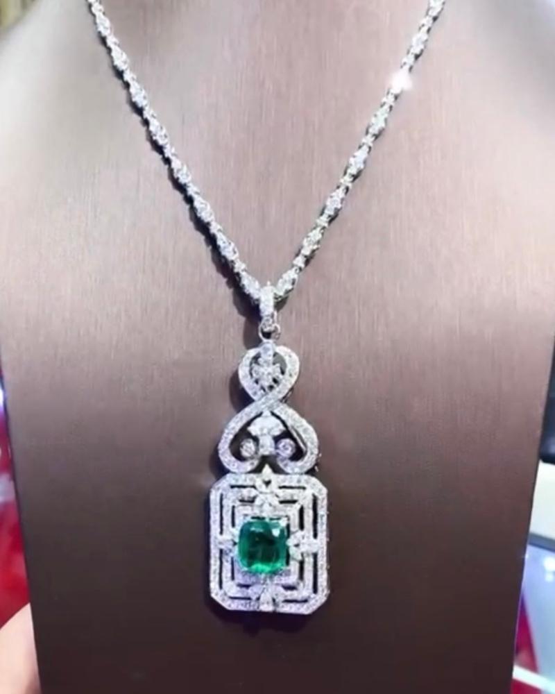 Magnificent Art Deco design in 18k gold for this necklace complete with gorgeous pendant. Necklace is in 18k gold with natural round brilliant cut diamonds ct 6,02 F/VS. Pendant is in 18k gold with natural Zambia emerald ct 6,94 and 20 pieces of