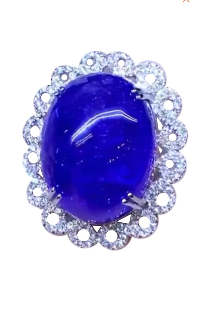 Oval Cut Ct 76 of Natural Tanzanites and Diamonds on Ring For Sale