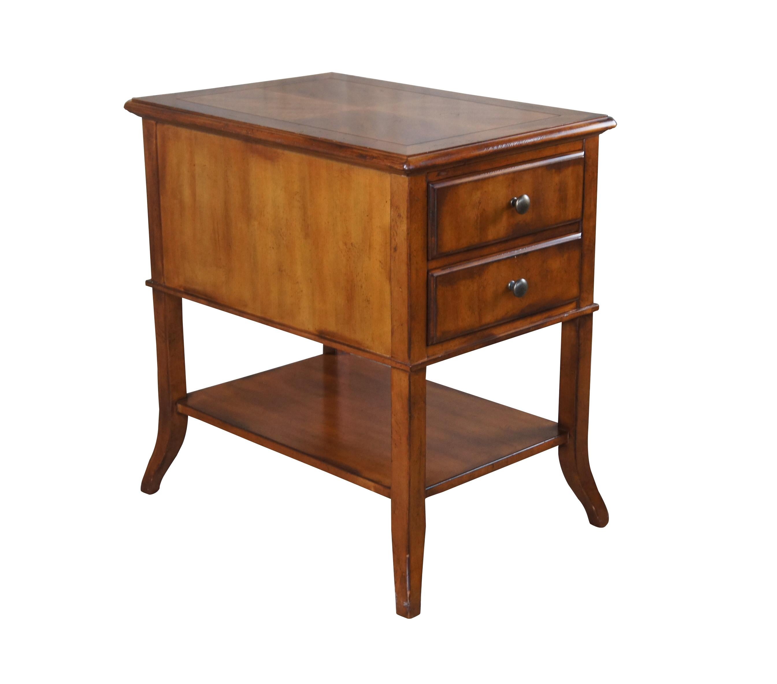 Vintage CTH Sherrill Occasional table featuring a tiered rectangular design with lower shelf, two drawers and flared legs.

Dimensions:
26.5