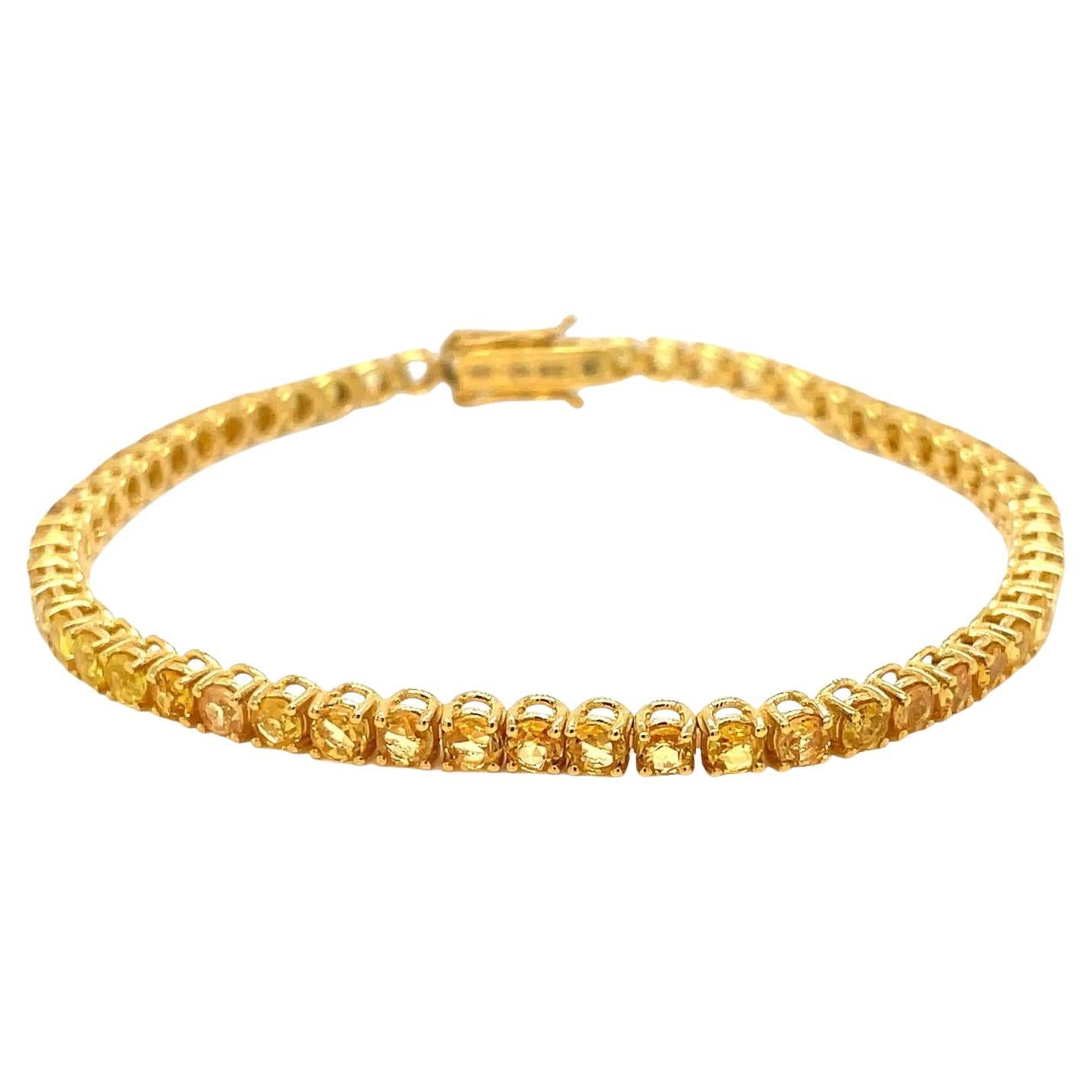 Gold-Tennisarmband mit CTW 6,5 natürlichem gelbem Saphir im Angebot