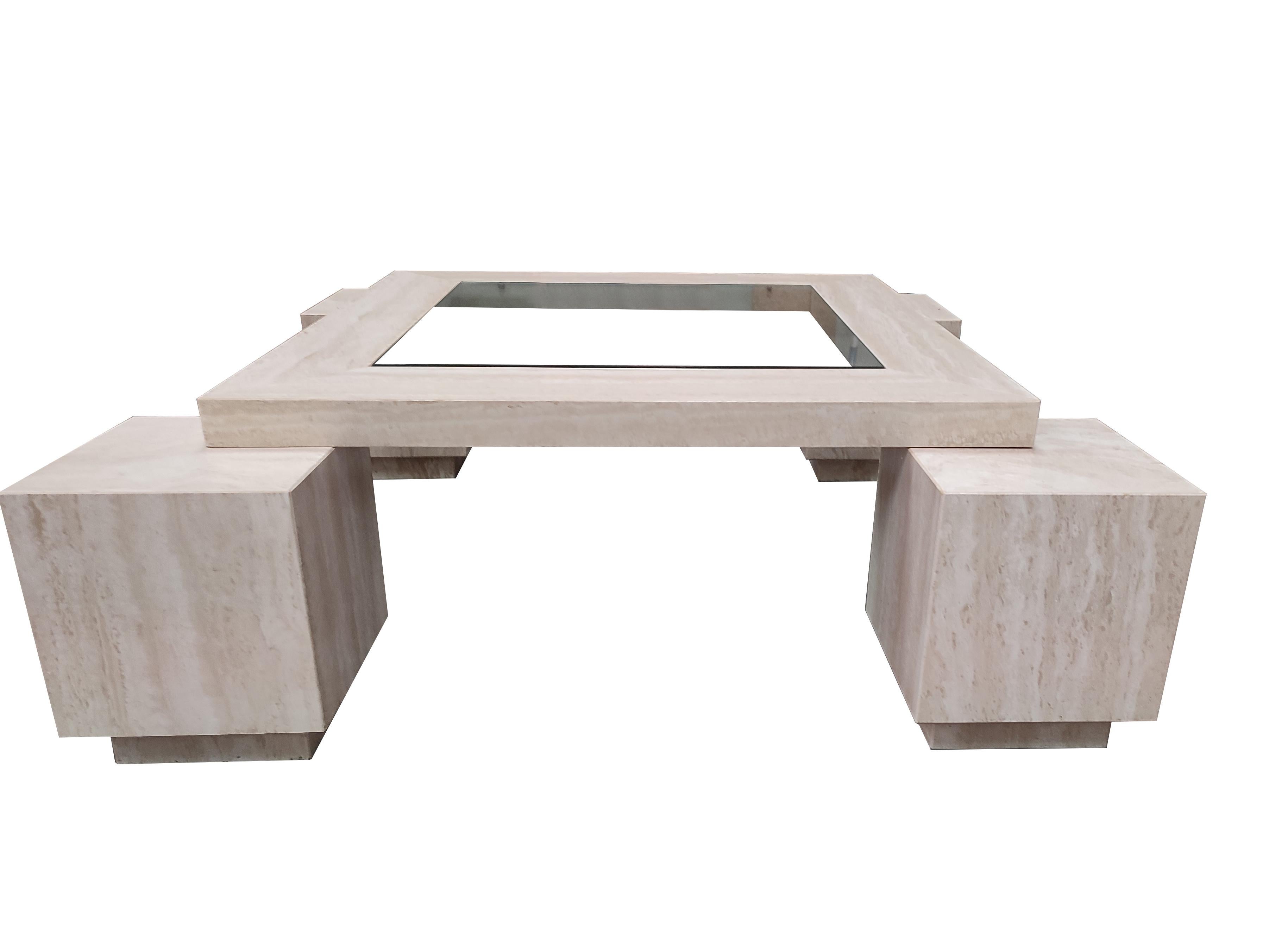 CUADROS MidCentury Polished Travertine Marble Coffee Table Original 80's Piece
The Cuadros coffee table is made of Roman travertine marble in polished finish, and the top contains a recessed glass top. The table has four cube-shaped legs that