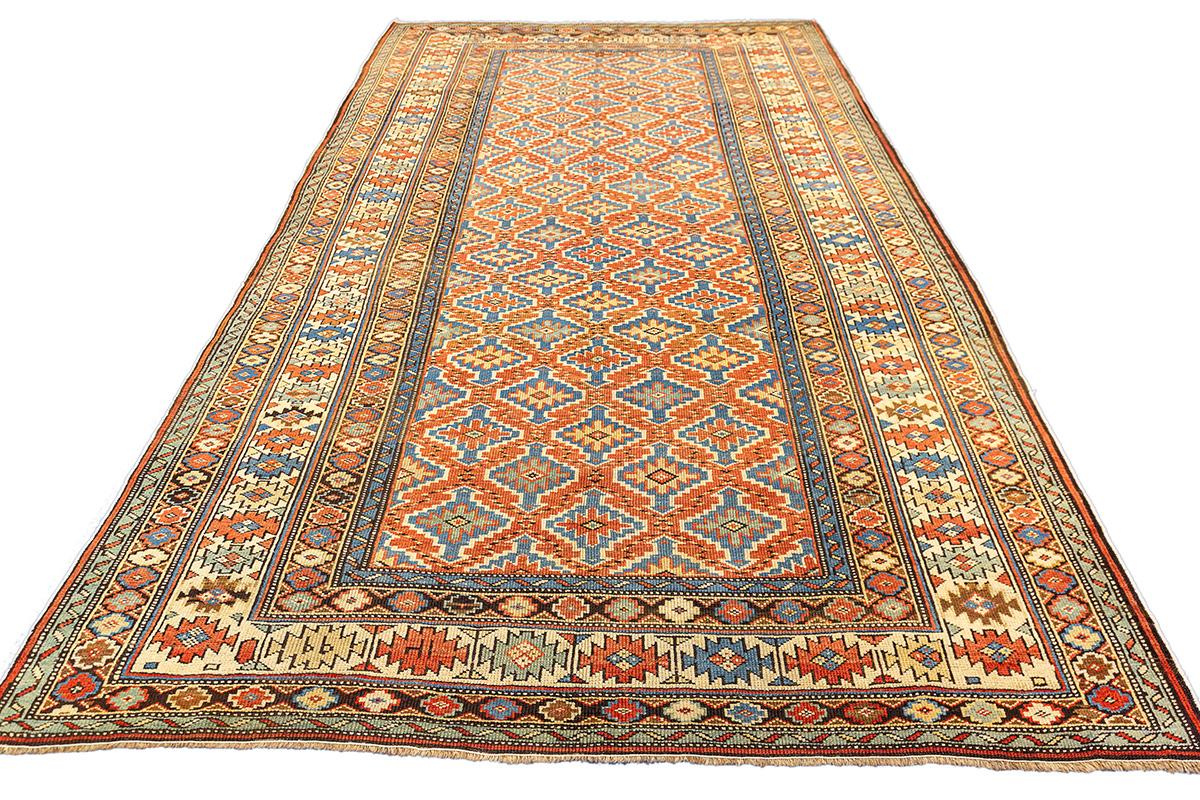 This exquisite Cuba antique rug from the 19th century exemplifies the precision, color clarity, and compositional finesse that have made Kuba weavings among the most celebrated of the Caucasian tradition. The all-over lattice design is structured