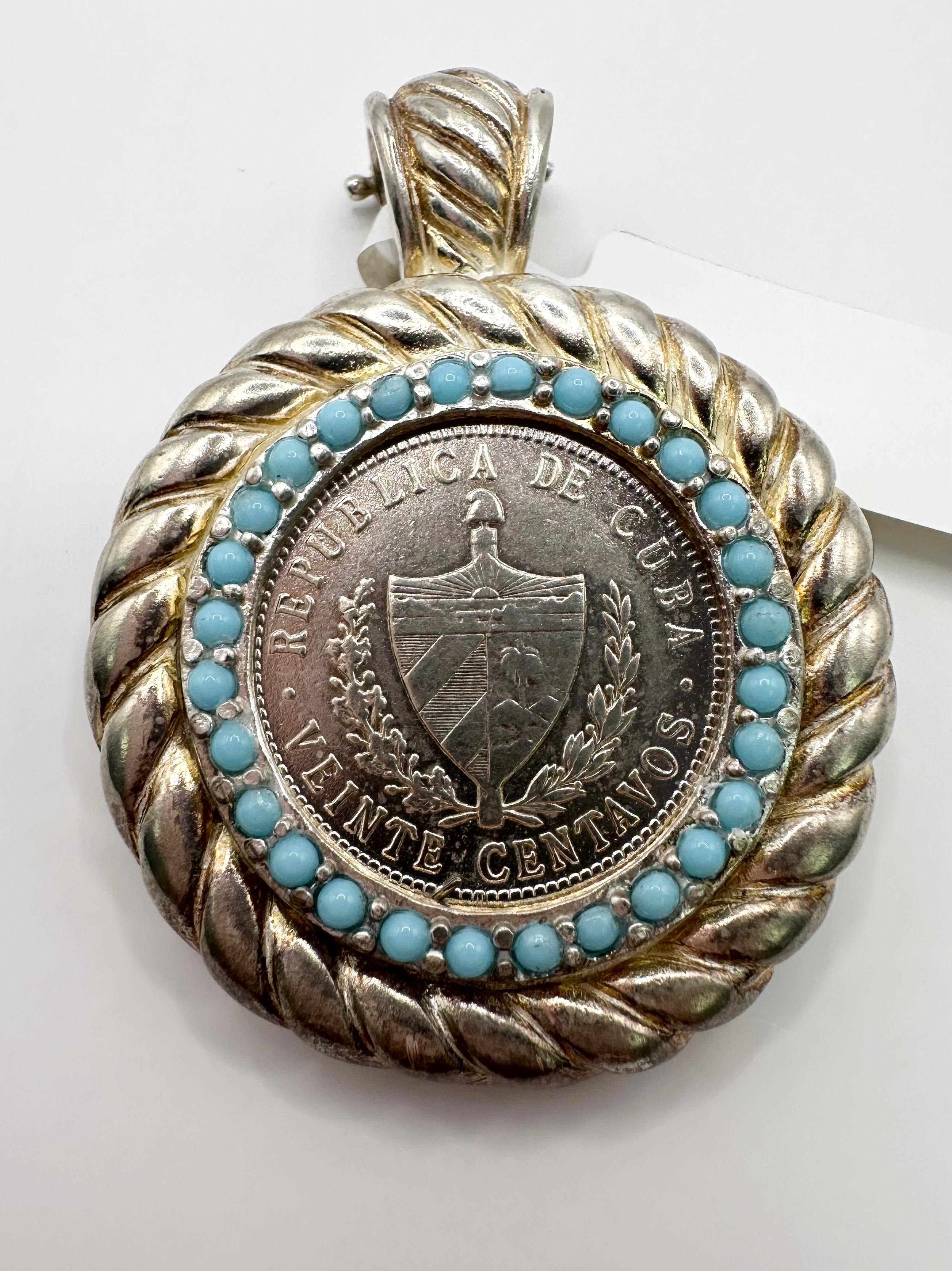 Coin pendant from Cuba, beautifully made with turquoise all around, pendant is in silver! Stunning workmanship !


Certificate of authenticity comes with purchase!

ABOUT US
We are a family-owned business. Our studio in located in the heart of Boca