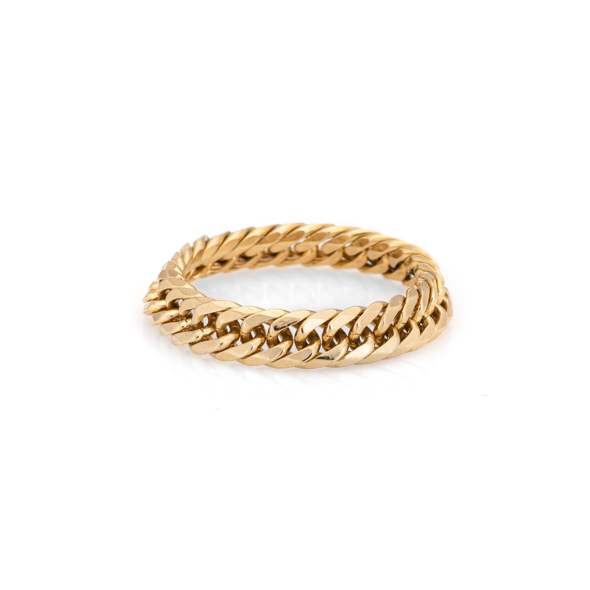Stylish Cuban link chain ring crafted in 18 karat yellow gold. 

The chain link ring is flexible and slips easily onto the finger. The low rise band (2mm - 0.07 inches) sits comfortably on the finger. Great worn alone or stacked with your fine