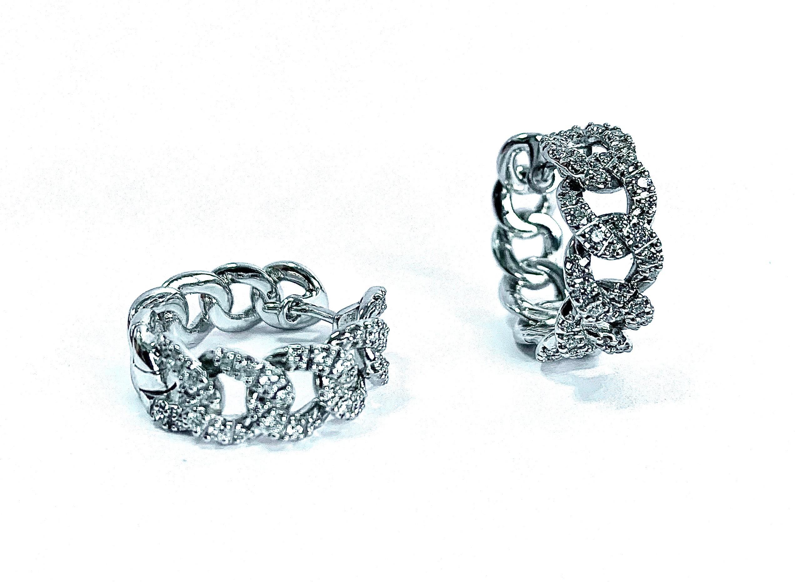 cuban solid white gold earrings hand made in italy
weight of gold gr 10.3
white diamond clarity g quality vvs1 ct 0.60