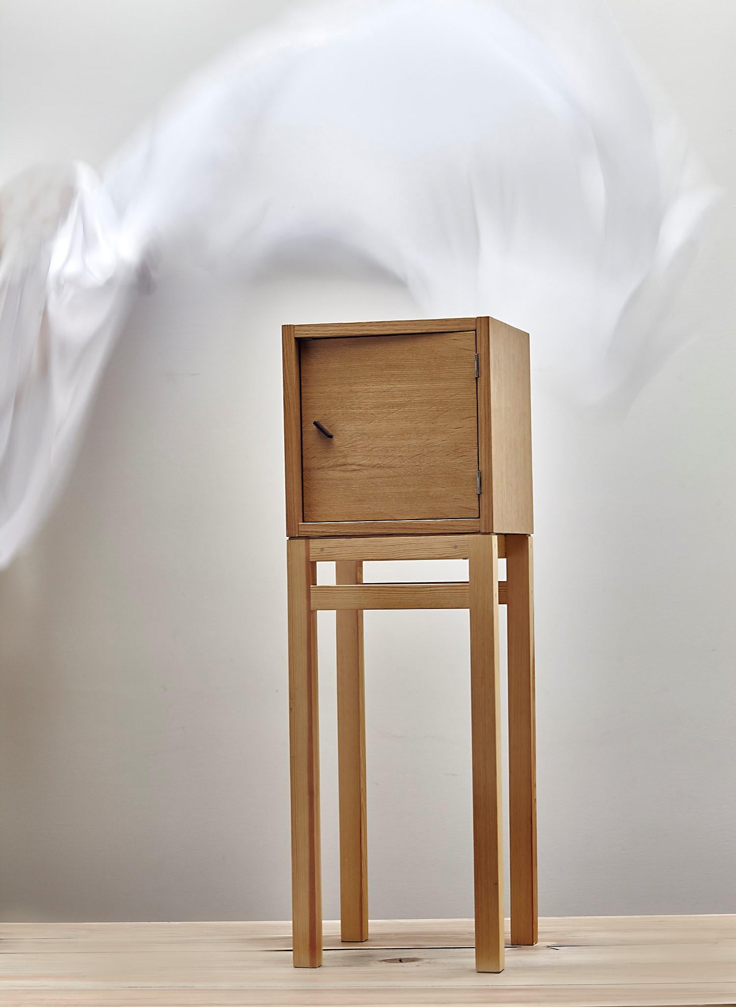 Cube cabinet by Jean-Baptiste Van den Heede
Signed and numbered
Dimensions: L 30 x W 30 x H 90 cm
Materials: Natural oakwood, nordic pine base

Cube cabinet, auxiliary furniture for bedside table, house entrance, bar cabinet or jewel