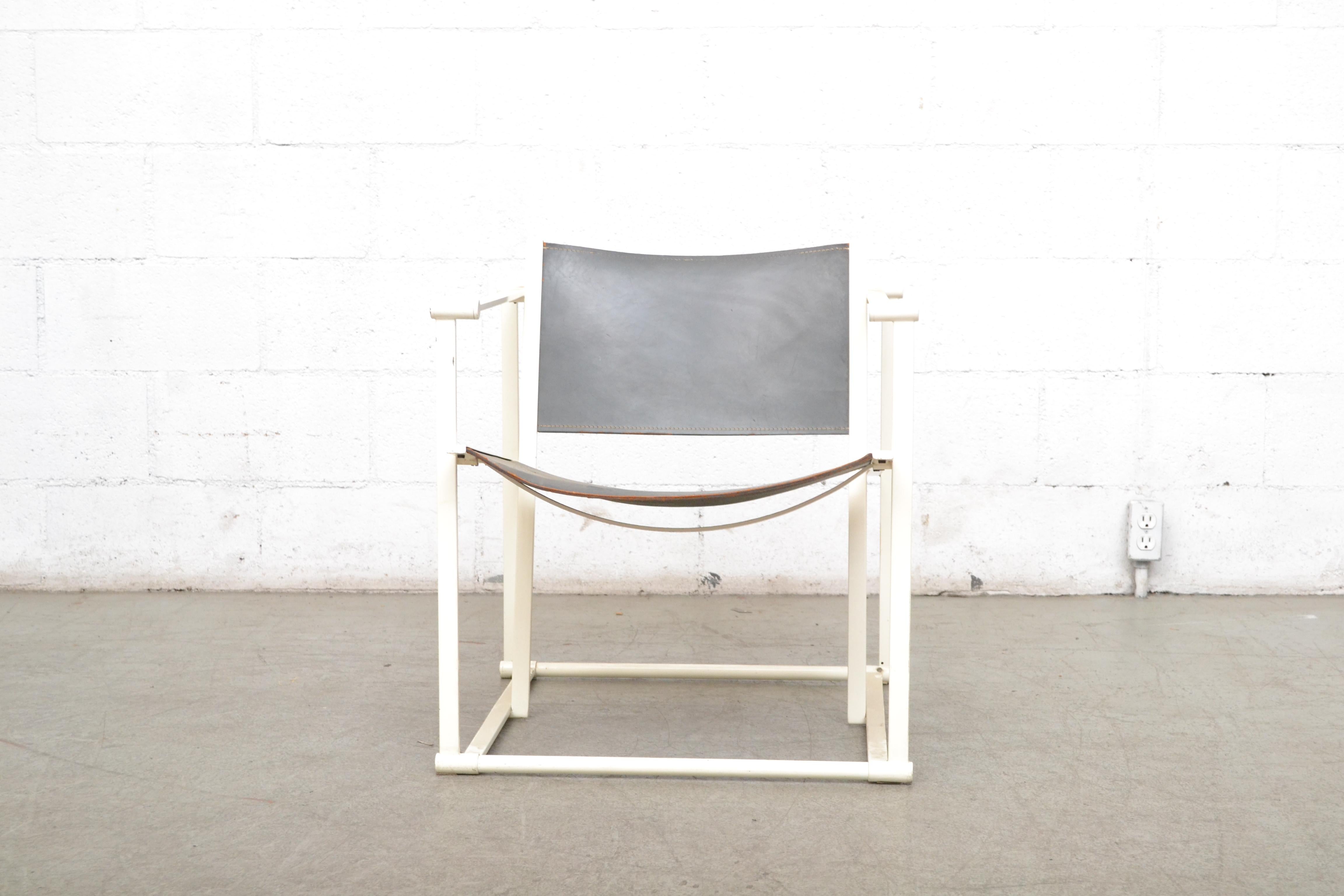 UMS Pastoe FM60, cubic lounge chair, designed in 1970 by Radboud van Beekum. Original white enameled steel cube frame with original grey leather seating. Visible scratching to frame and leather. Both frames and seats are in original condition with