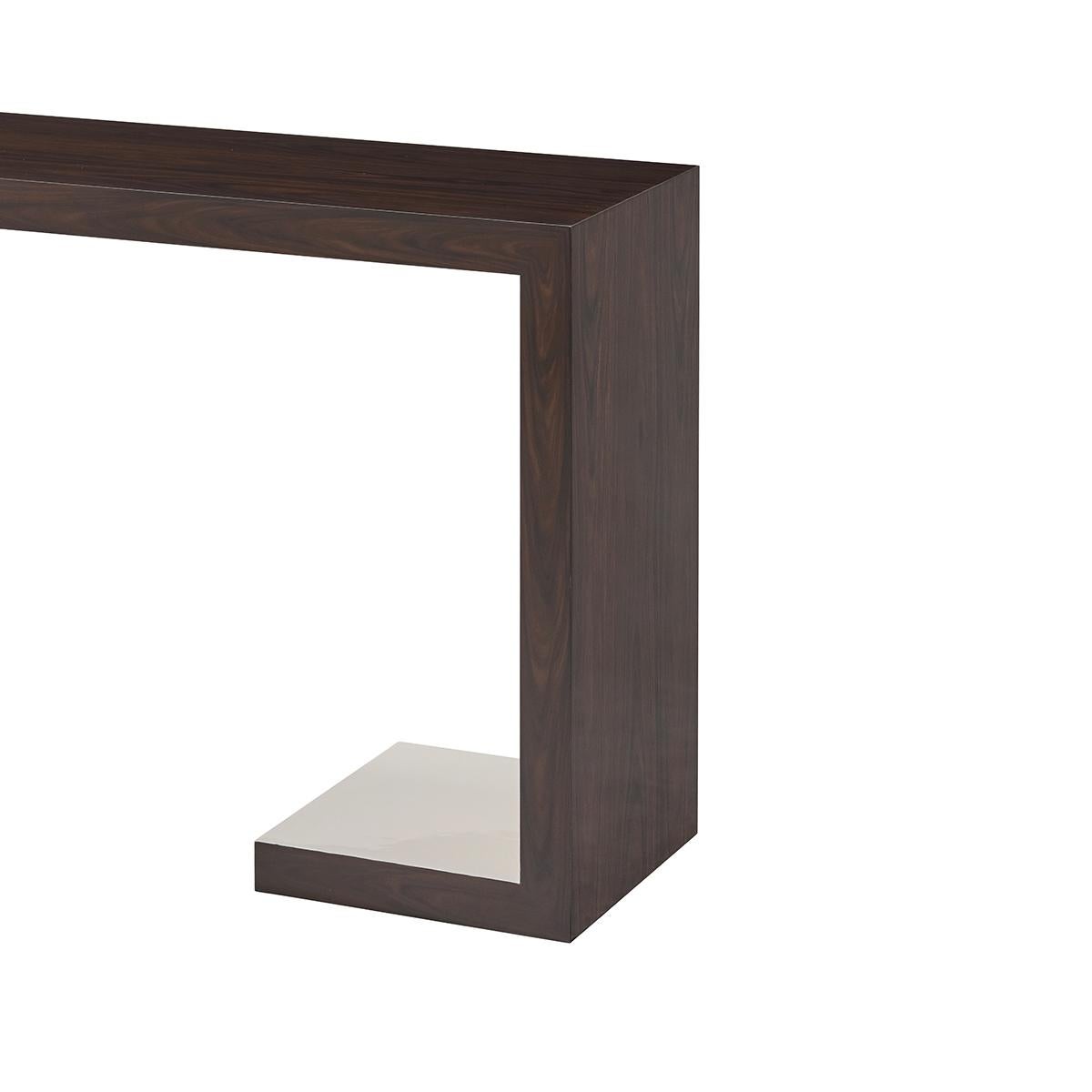 Simple and elegant, this modern console table with framed with a Morado veneered exterior and has an interior finish of painted morning white lacquer.

Dimensions: 65