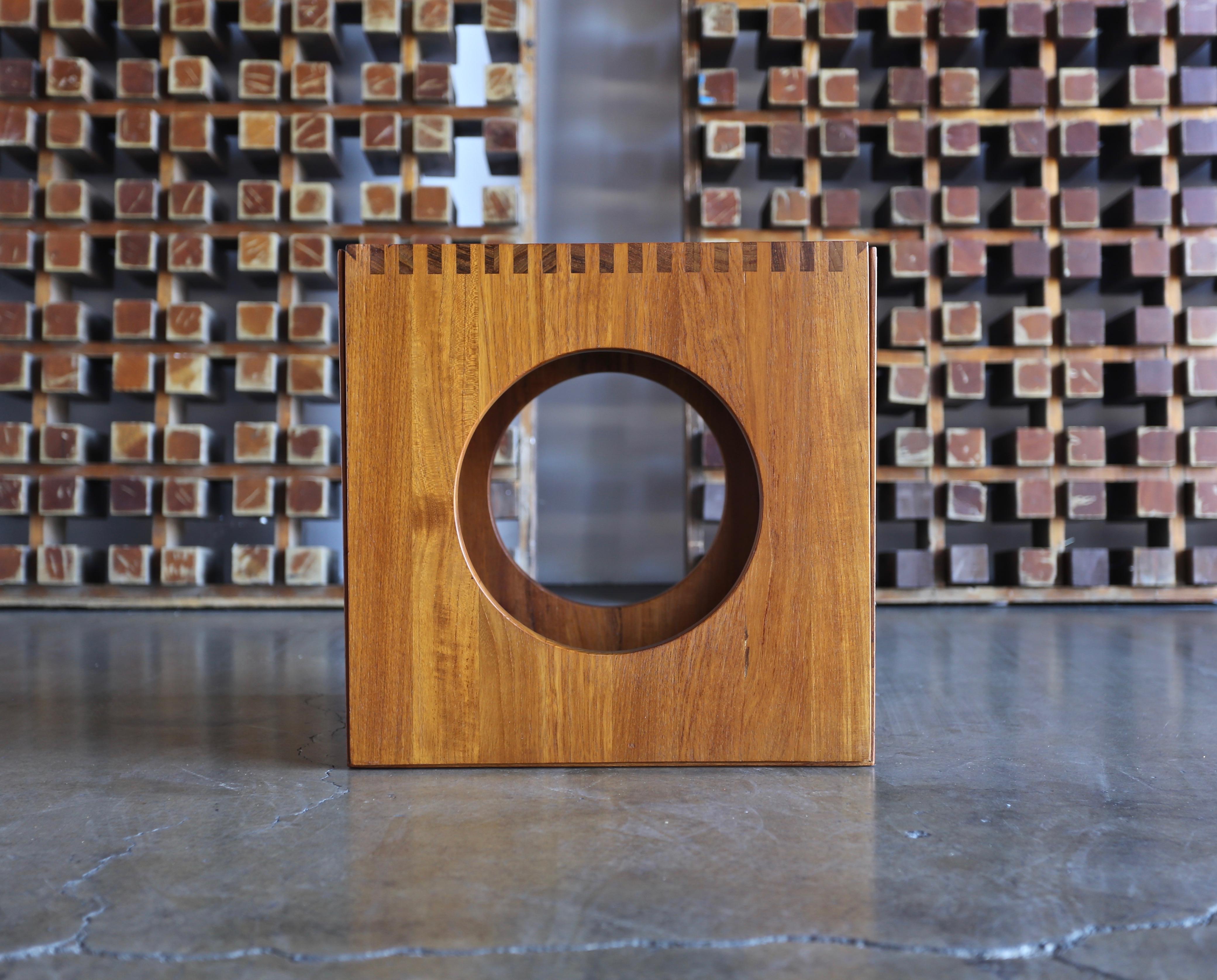 Cube nesting tables by Peter Hvidt for Richard Nissen. A pair of solid teak side tables with box cut finger joints and mitered edges. The tables can fit together to form a cube.