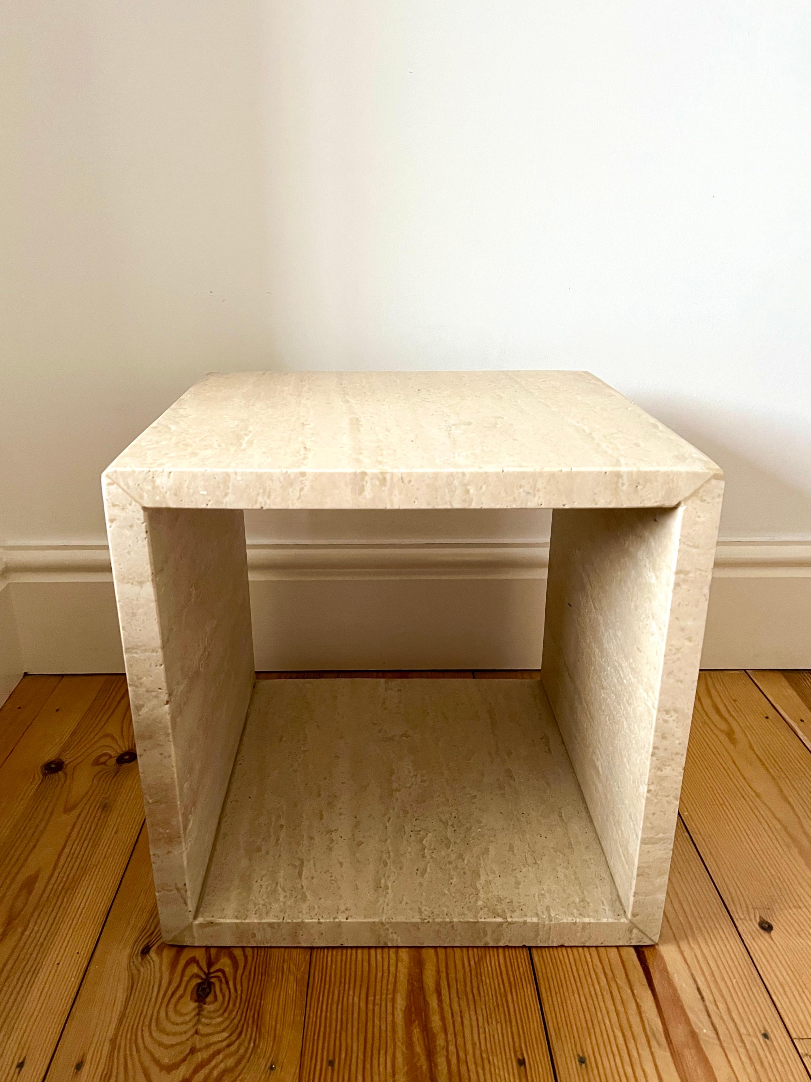 Cube side table in natural travertine stone.

Light tone travertine in a matt Finnish.

Excellent condition. No damage, chips, scratches or stains.