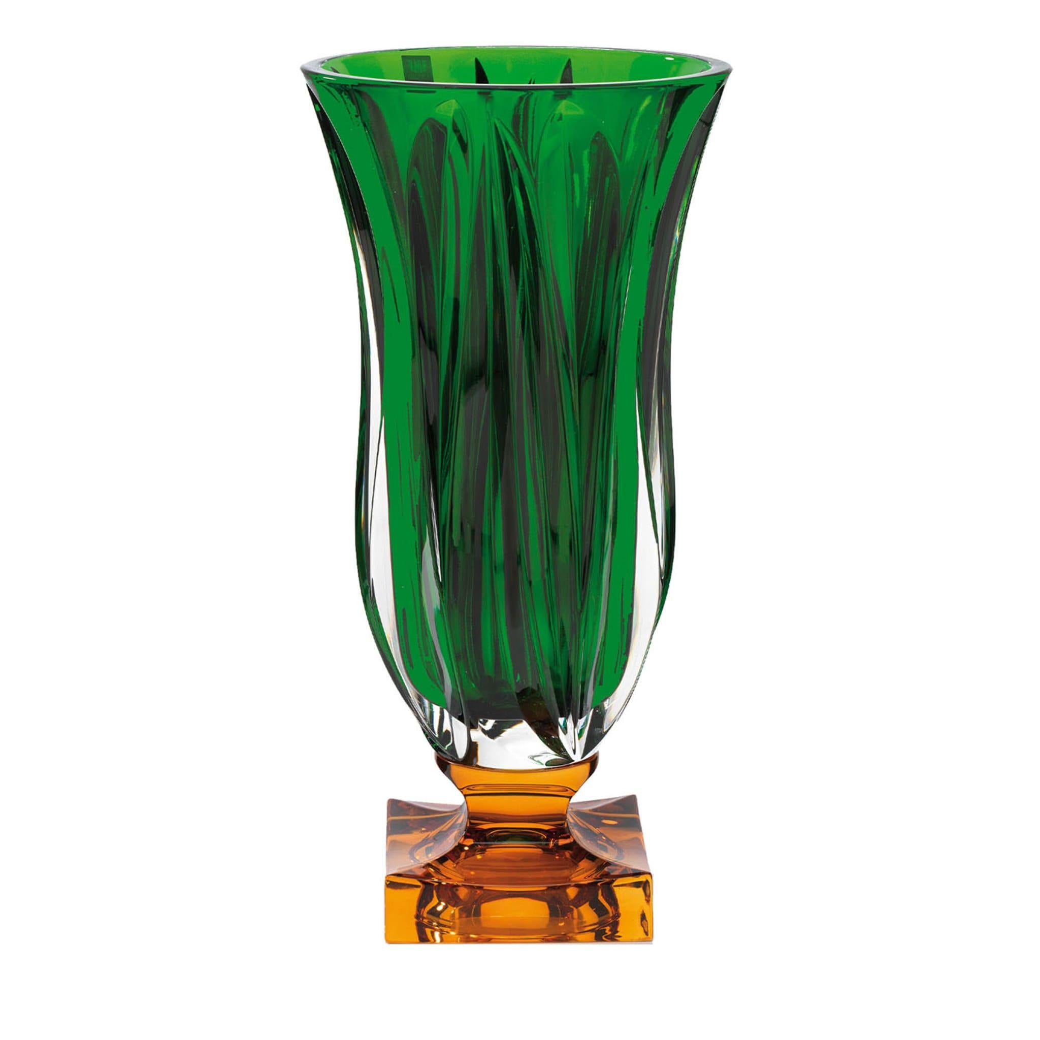 A superb dash of color and elegant texture distinguish this stunning crystal vase of the Cube Collection. A short, clear stem links the round foot with the elongated bowl, both in vibrant emerald green. The bowl's is hand decorated with repeating