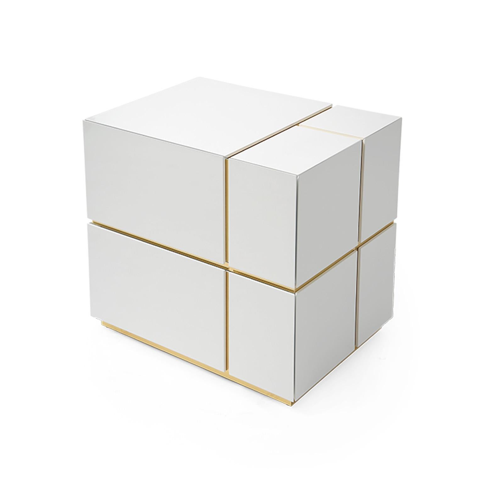 This modern bedside table diamond gently fits the bedroom atmosphere by contrasting white and brass. The handcrafted construction has a high gloss white finish and brass details. Made of wood, plywood and brass, the bedside table diamond features